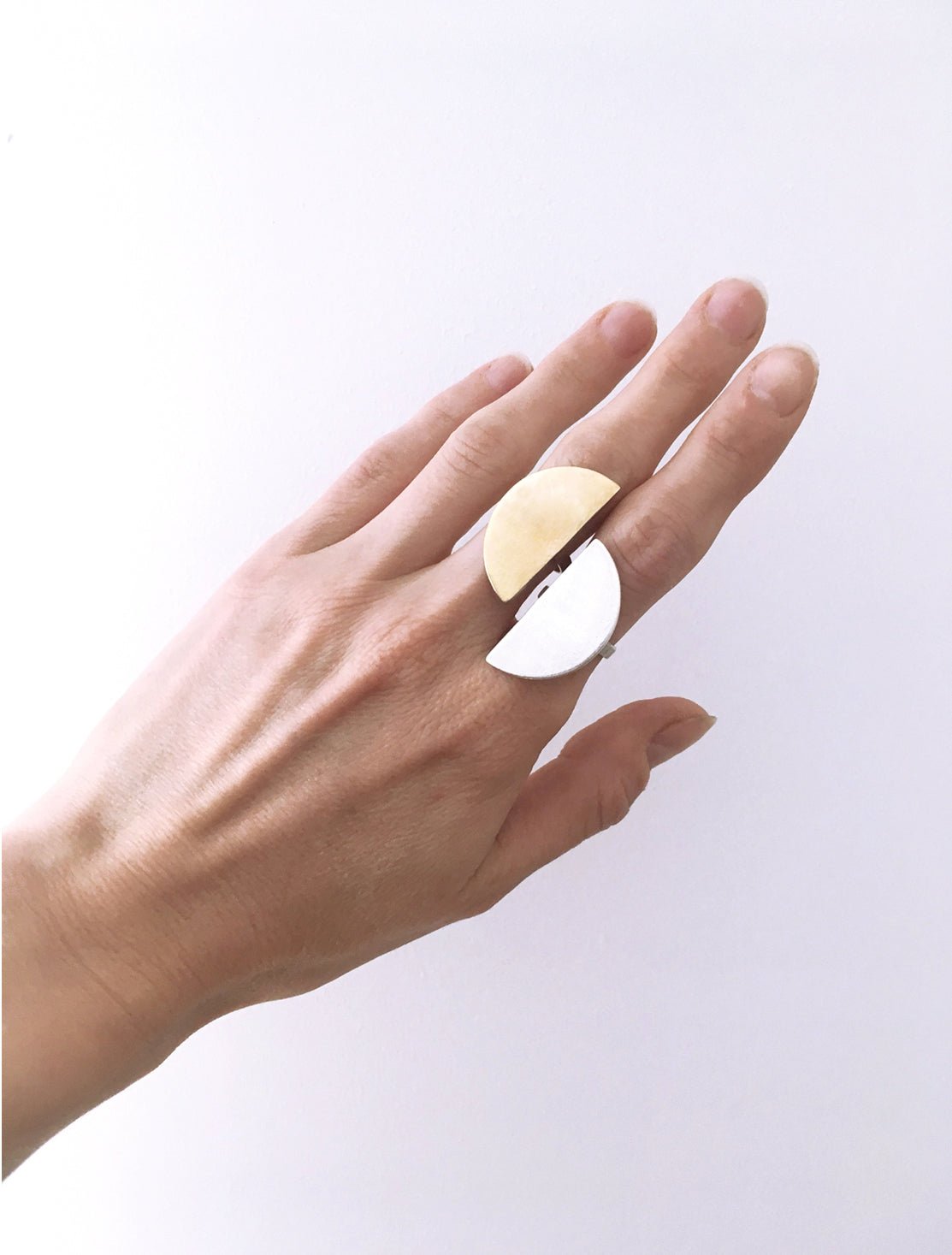 Moon ring in silver minimal crescent. Minimalist modern jewelry handcrafted in Brooklyn New York by designer llayers.