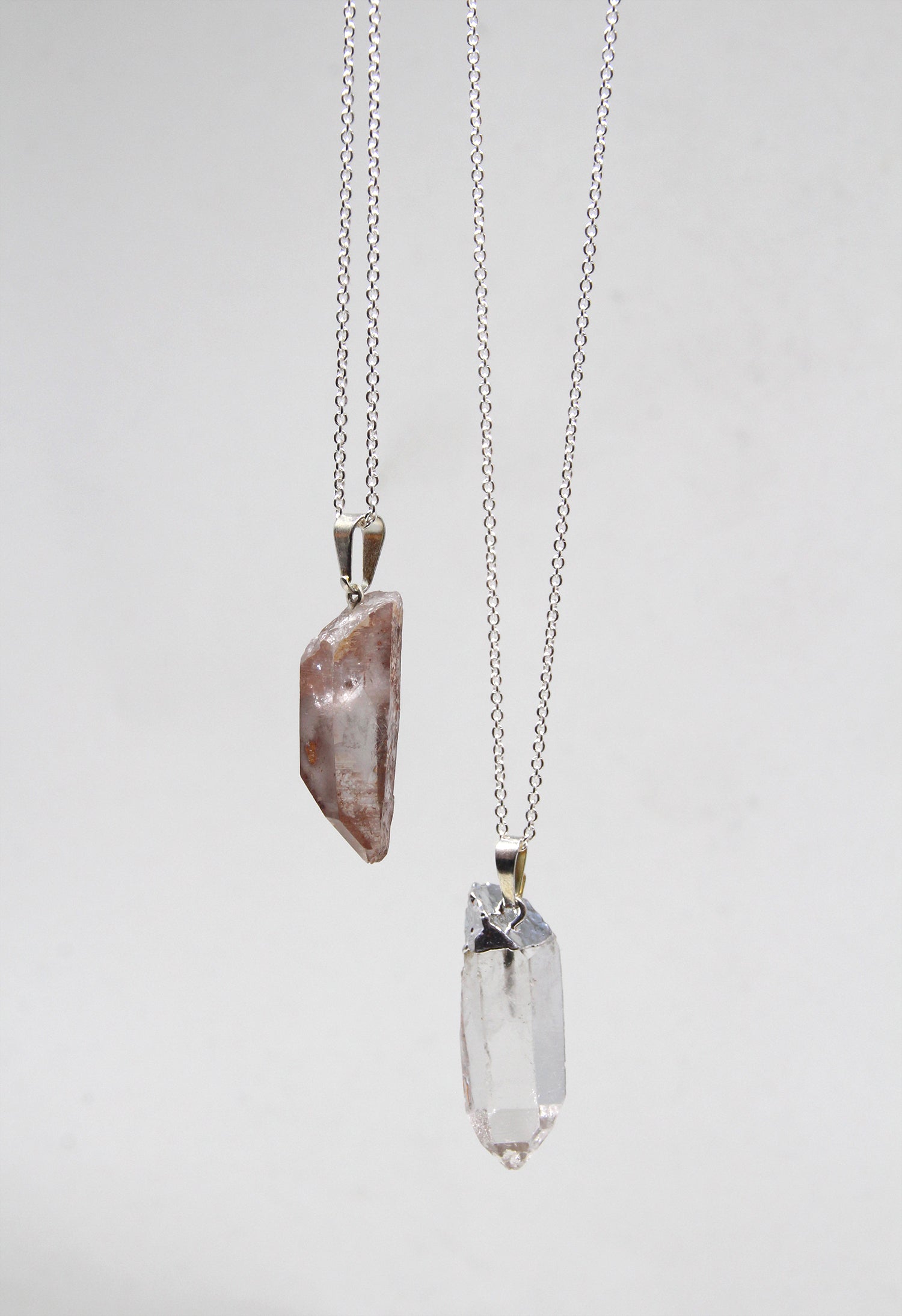 Silver Quartz Crystal point pendant necklace. Charms and healing crystal stones jewelry, made in New York by llayers.