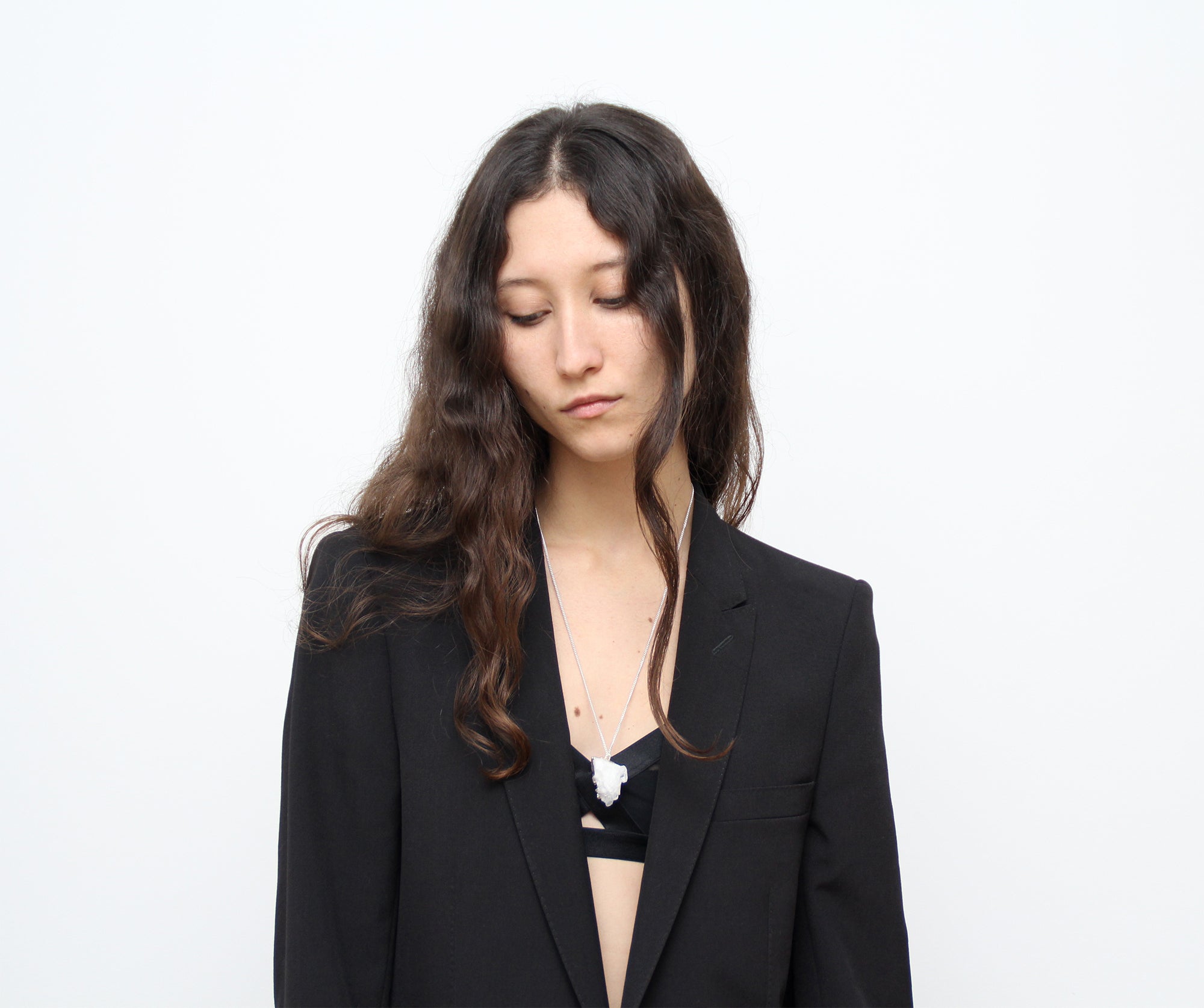 Quartz Crystal point pendant silver necklace. Charms and healing crystal stones jewelry, made in New York by llayers.