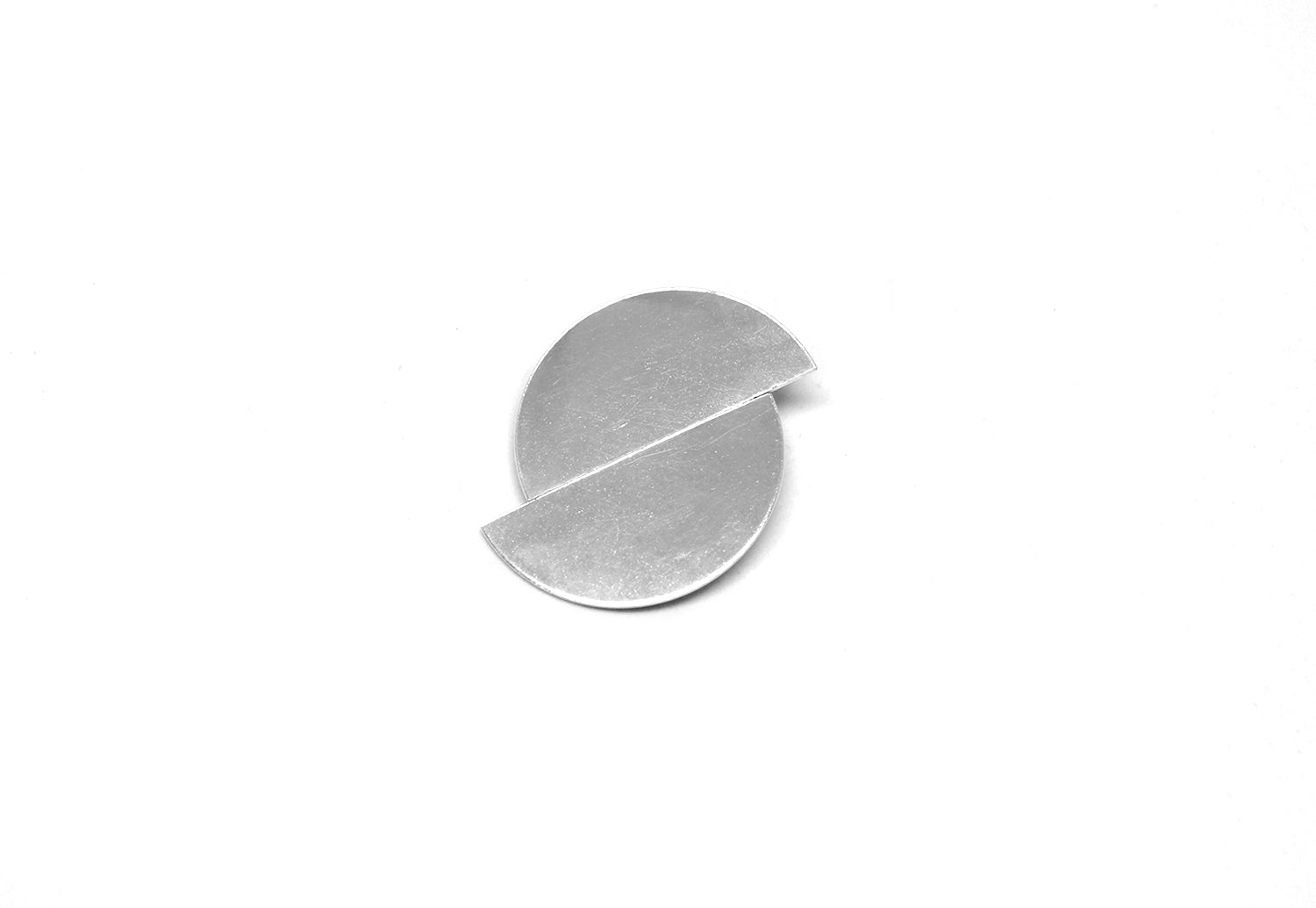 Silver statement earring minimalist jewelry. Men's and women's minimalist jewelry brand Made in New York by llayers. Fusion.