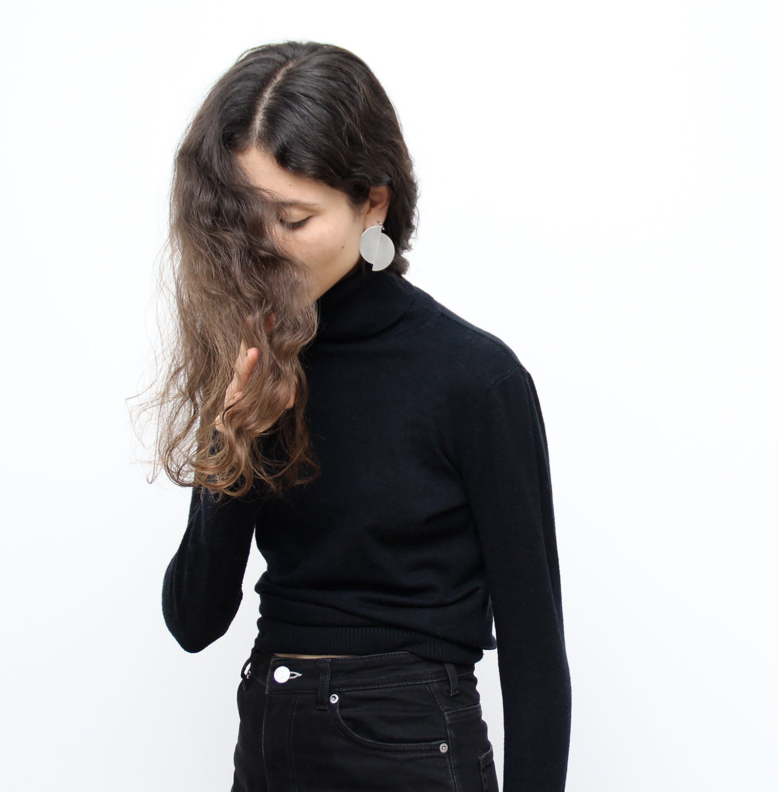Silver statement earring minimalist jewelry. Men's and women's minimalist jewelry brand Made in New York by llayers. Fusion.