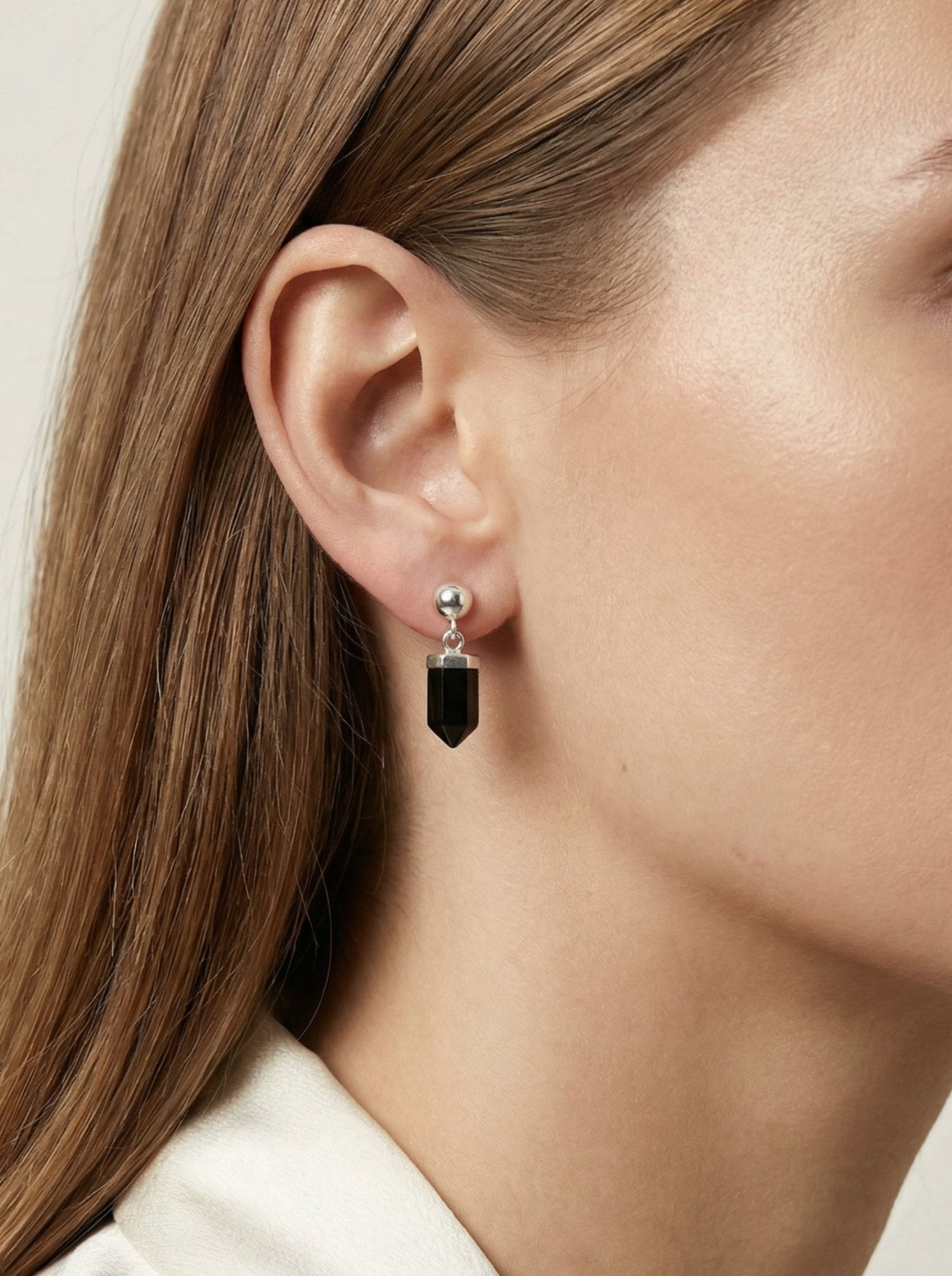 Black Agate stone earrings on a silver sphere. Minimal jewelry in the Us, New York by llayers.