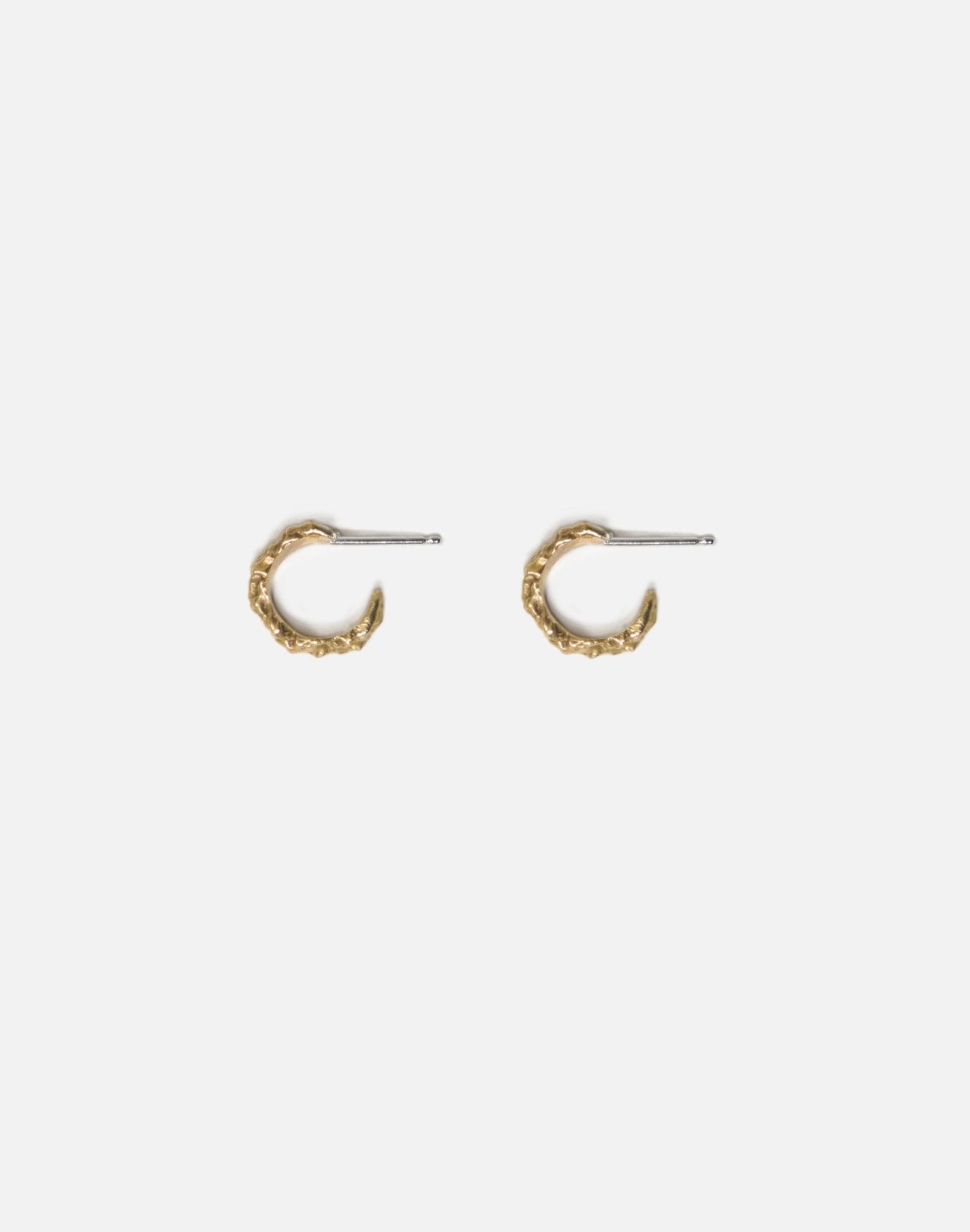 Gold designer hoop earrings granite. Emerging designer. Minimalist jewelry made in Brooklyn New York by llayers.