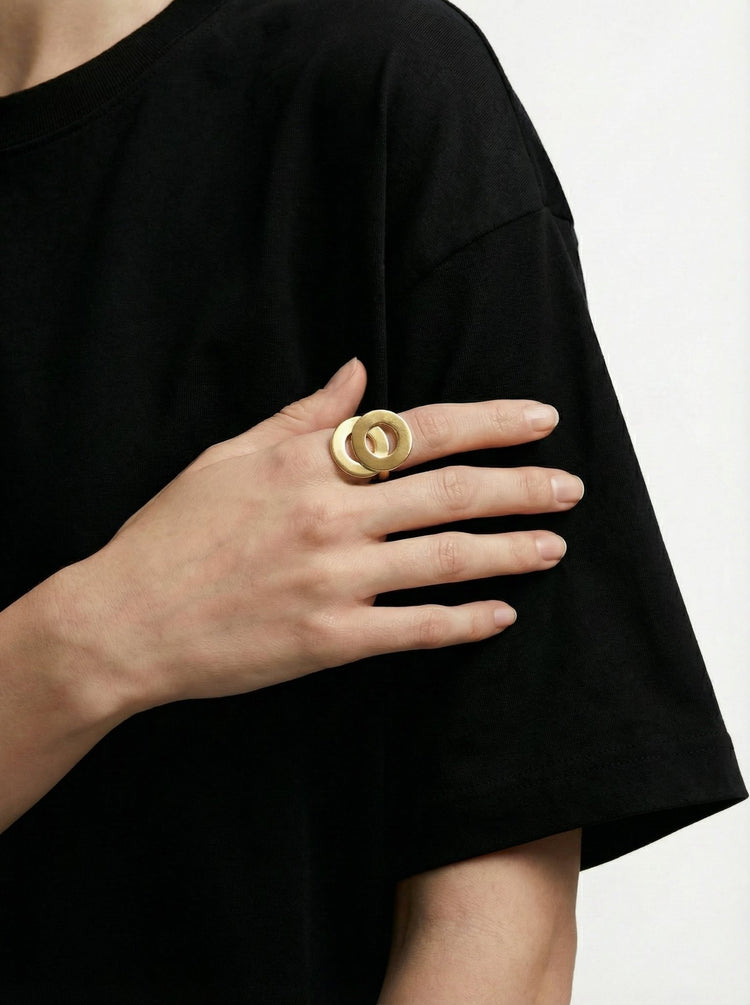 Gold infinity ring with interlaced symbol circles. Modern jewelry handcrafted in Brooklyn New York by designer llayers.