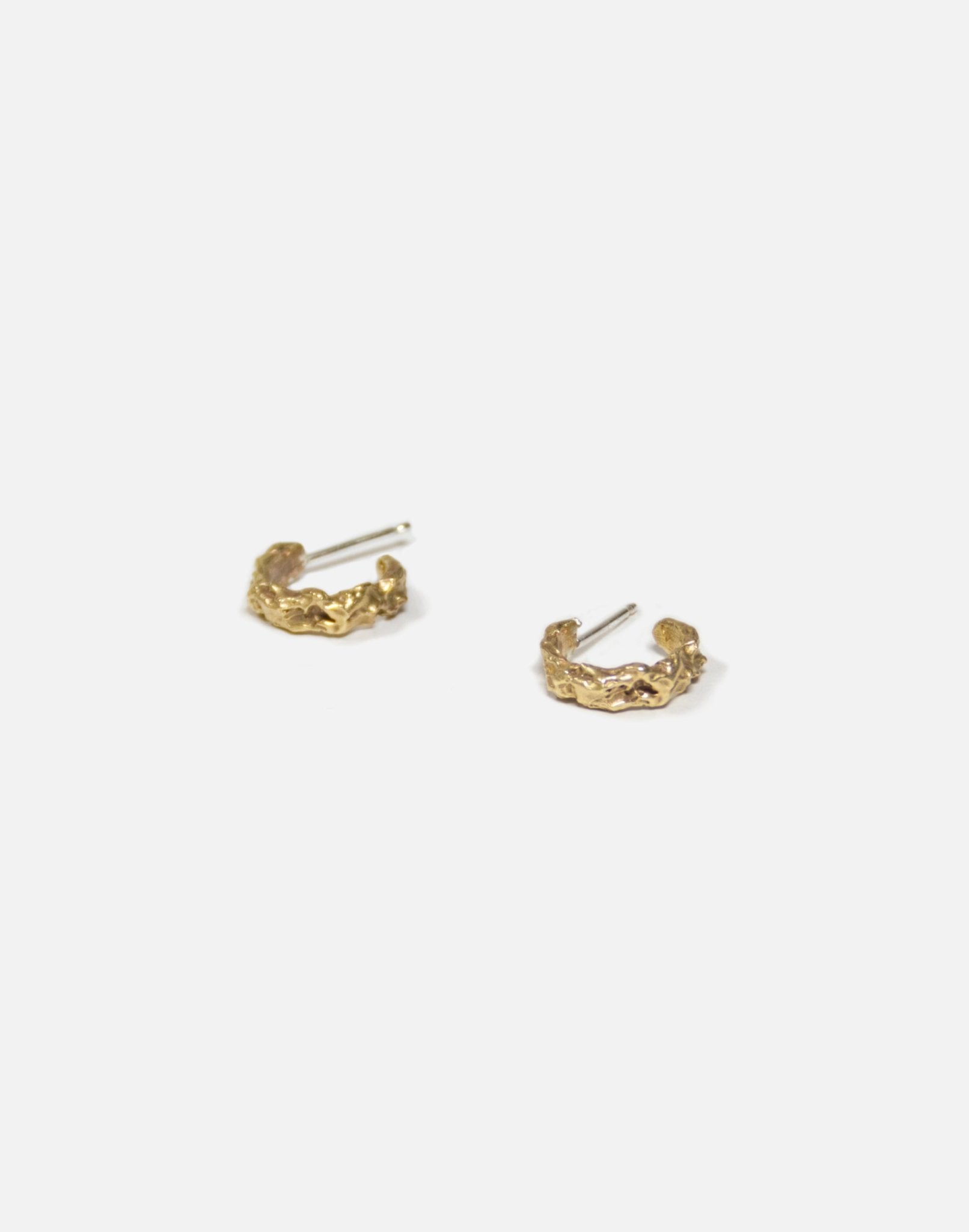 Gold refined hoop earrings granite. Emerging designer. Minimalist jewelry made in Brooklyn New York by llayers.