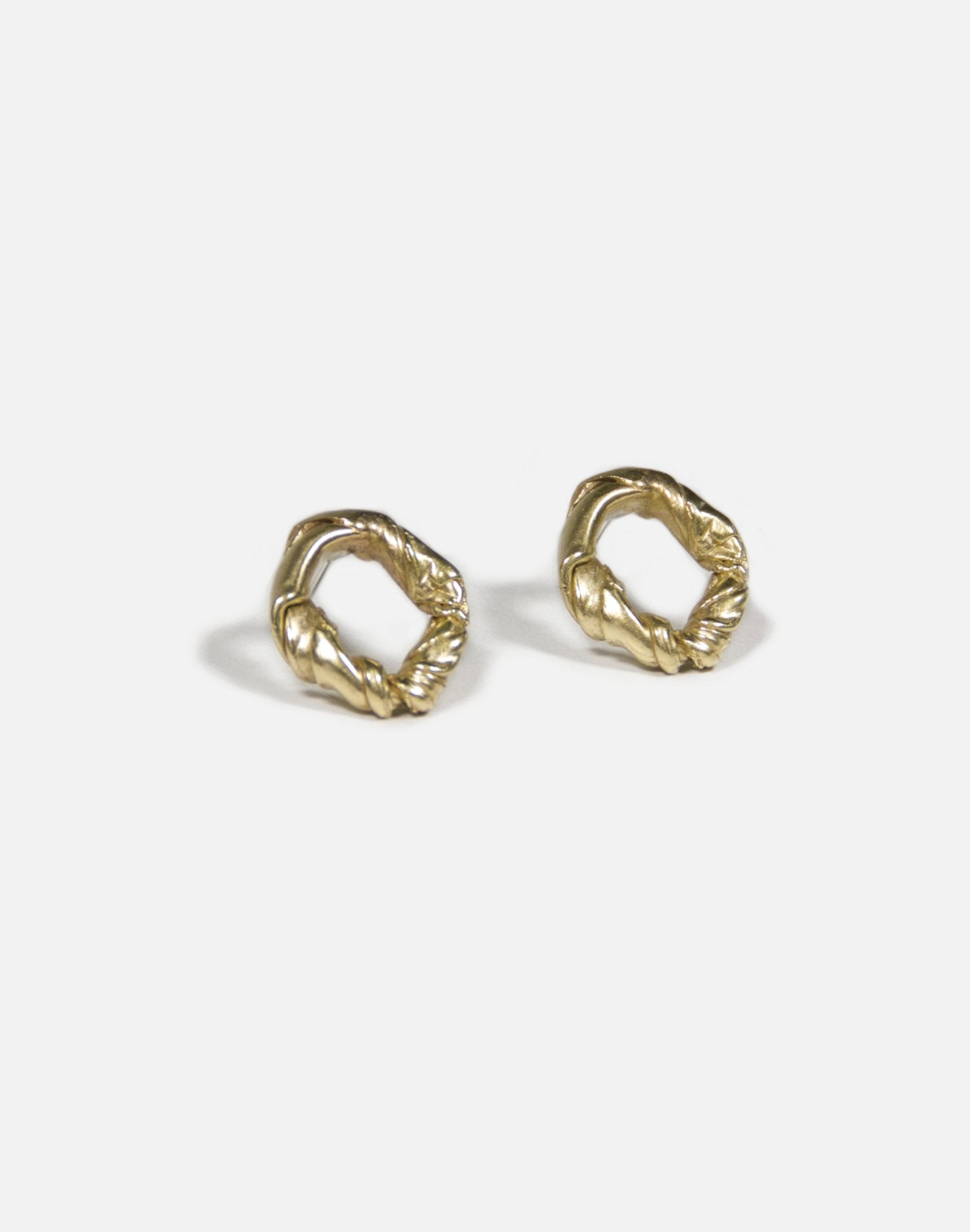 Gold brass minimalist modern twisted earrings. Made in Brooklyn New York by designer llayers.