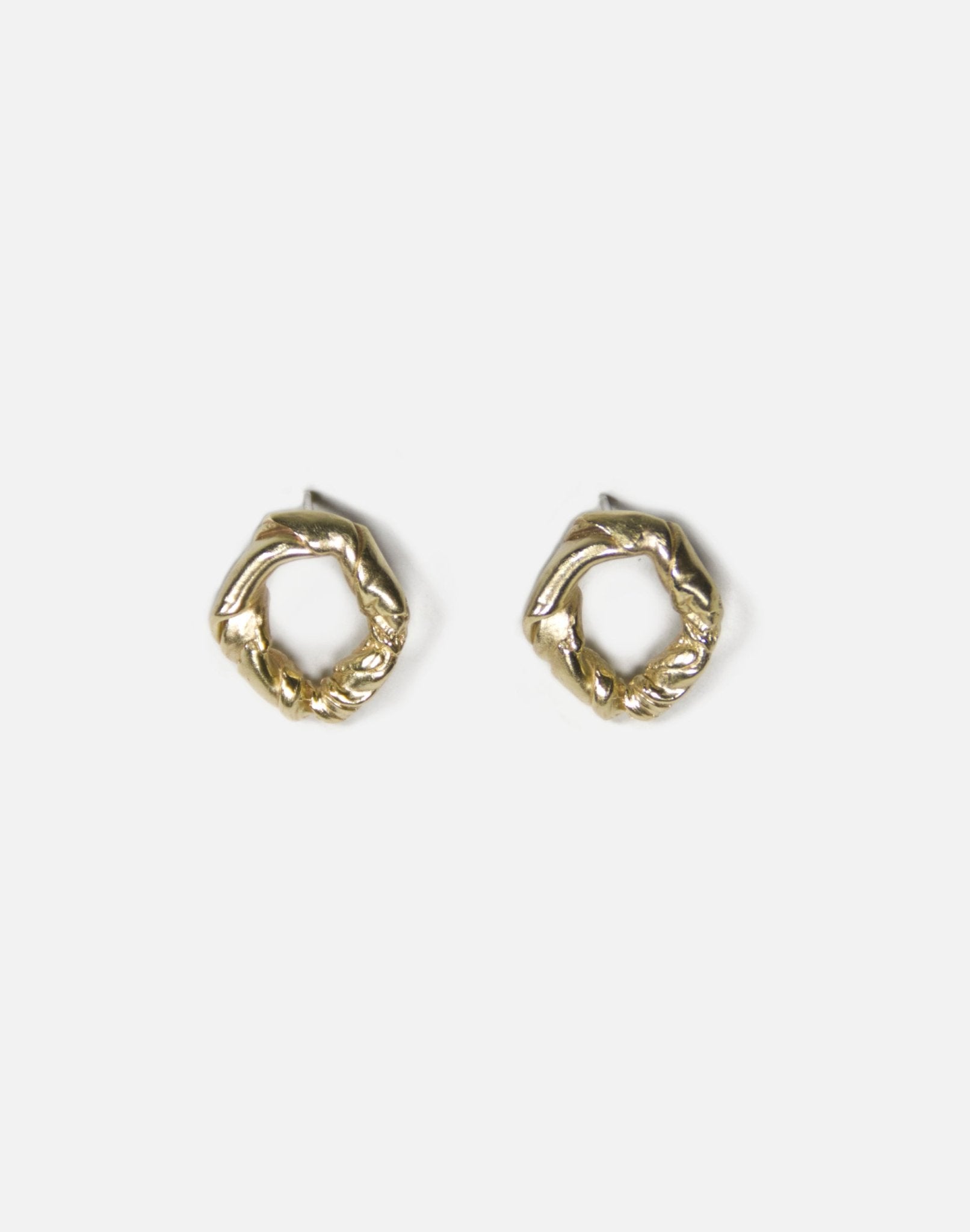 Gold brass minimalist modern twisted earrings. Made in Brooklyn New York by designer llayers.