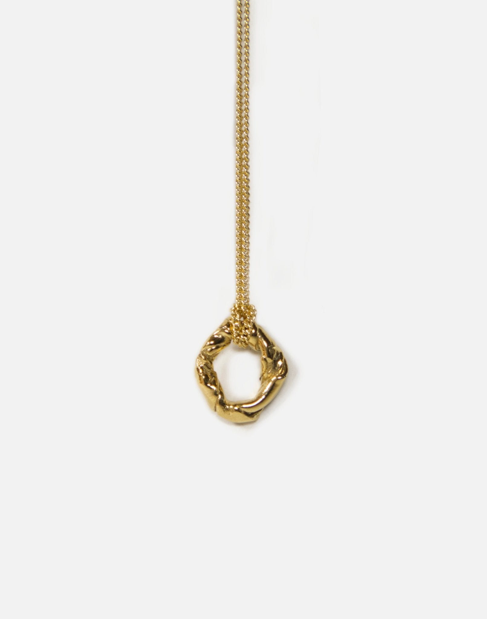 Gold modern twisted pendant necklace. Jewelry made in Brooklyn New York by designer llayers.