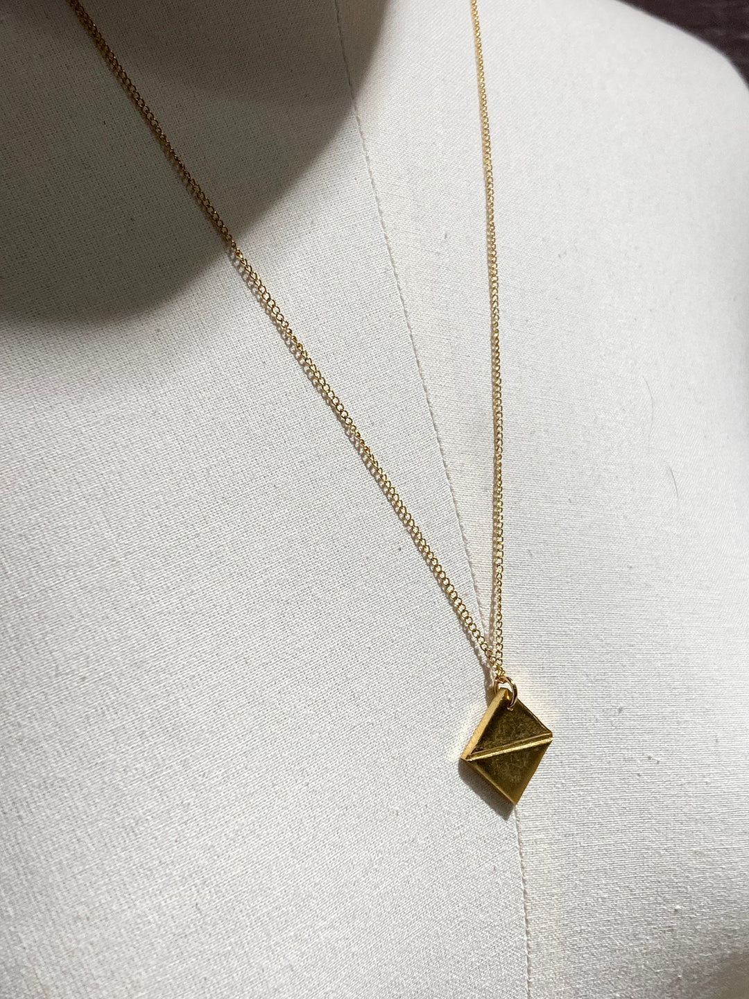 Gold talisman pendant necklace synthesis new york brooklyn by unisex minimalist jewelry designer llayers