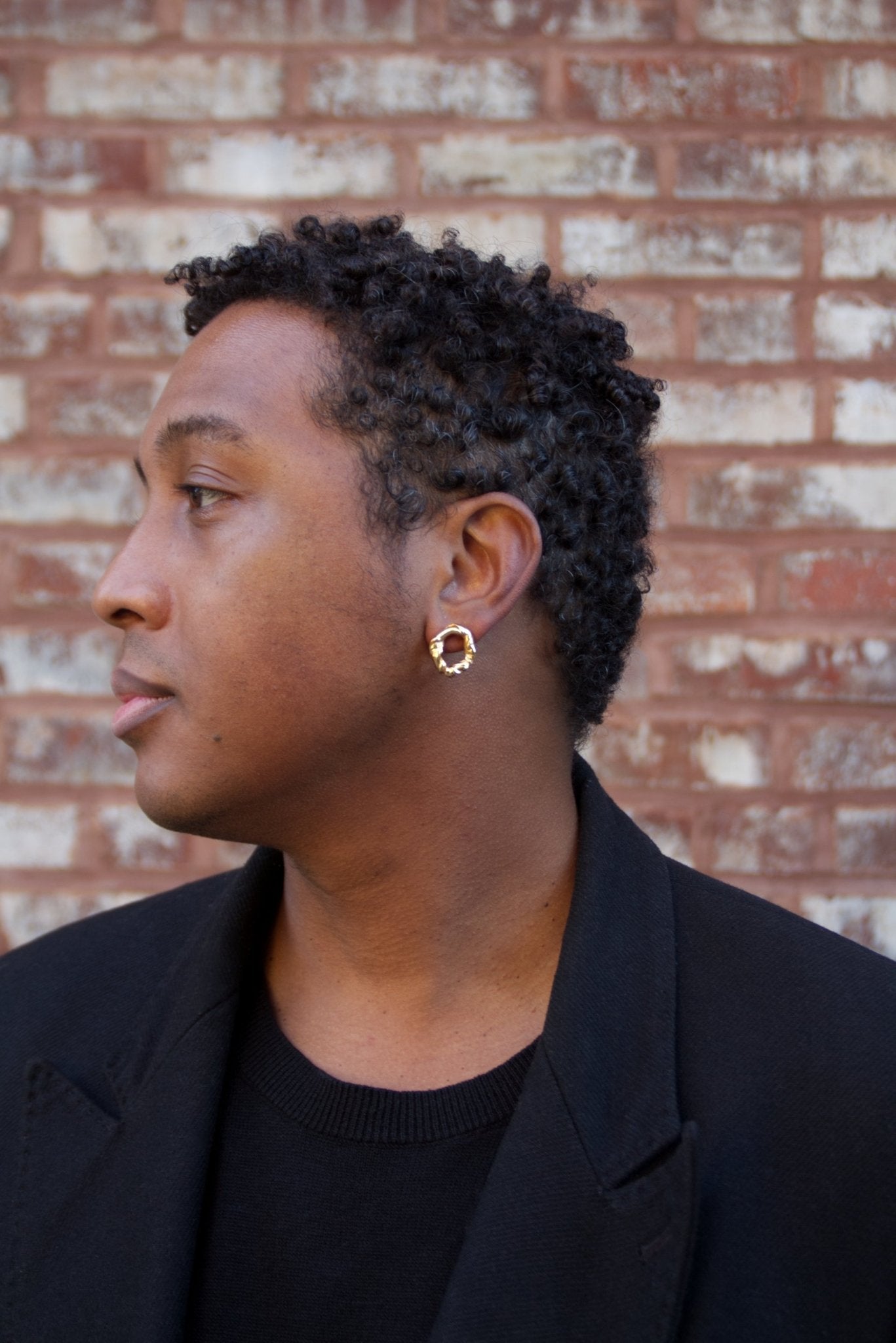 Men Gold minimalist modern twisted earrings. Made in Brooklyn New York by designer llayers.