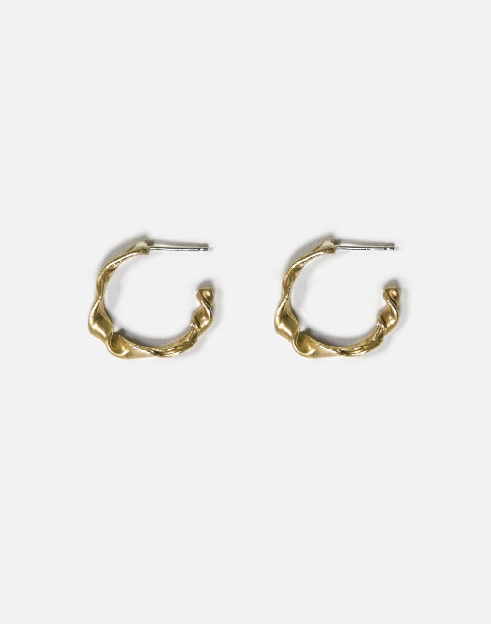Men's women's Gold twisted hoop earrings essence. Best minimalist jewelry made in Brooklyn New York by llayers.