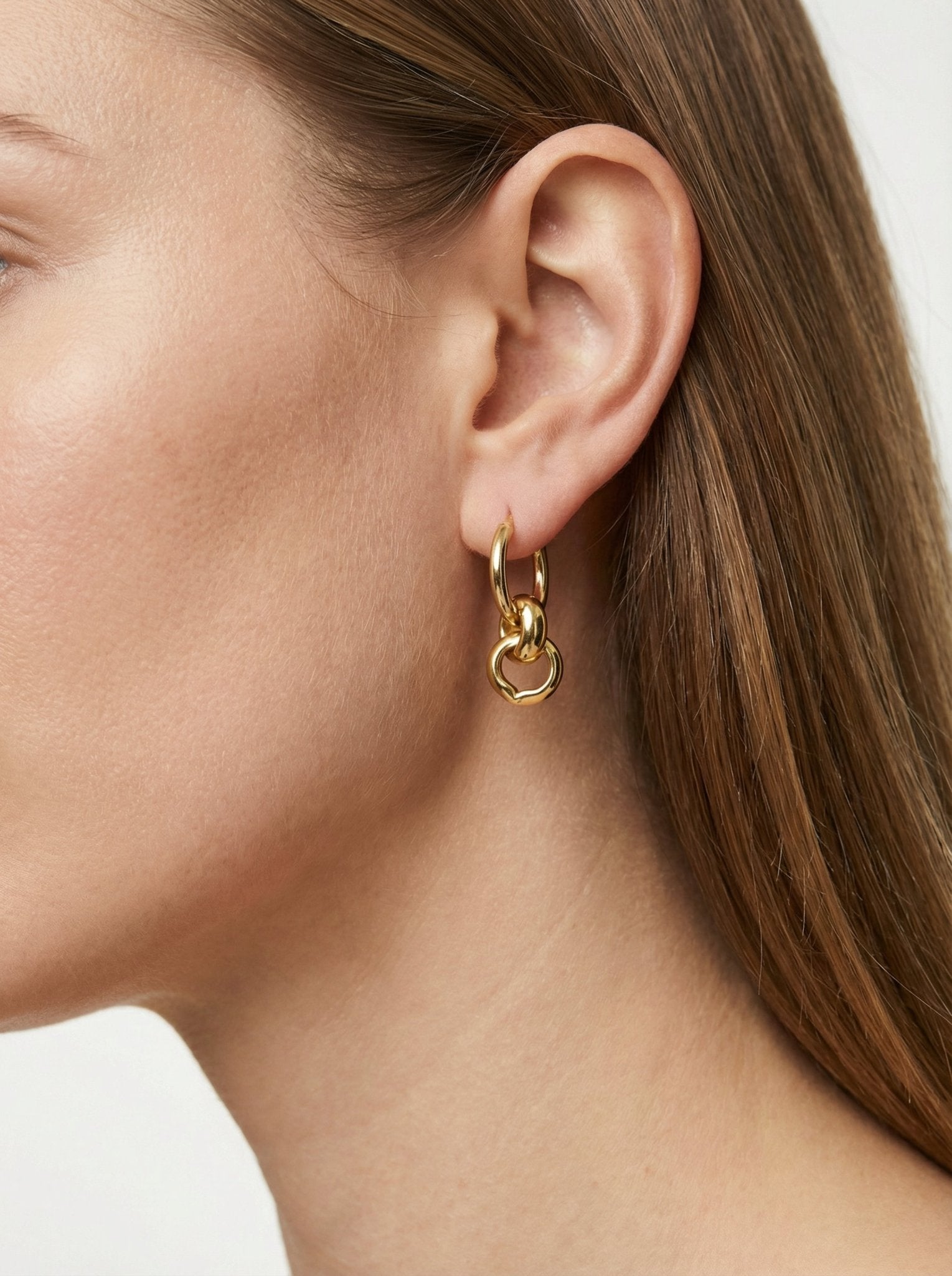 Gold hoop earrings infinity jewelry. Trendy minimalist timeless affordable jewelry handcrafted in New York by llayers.