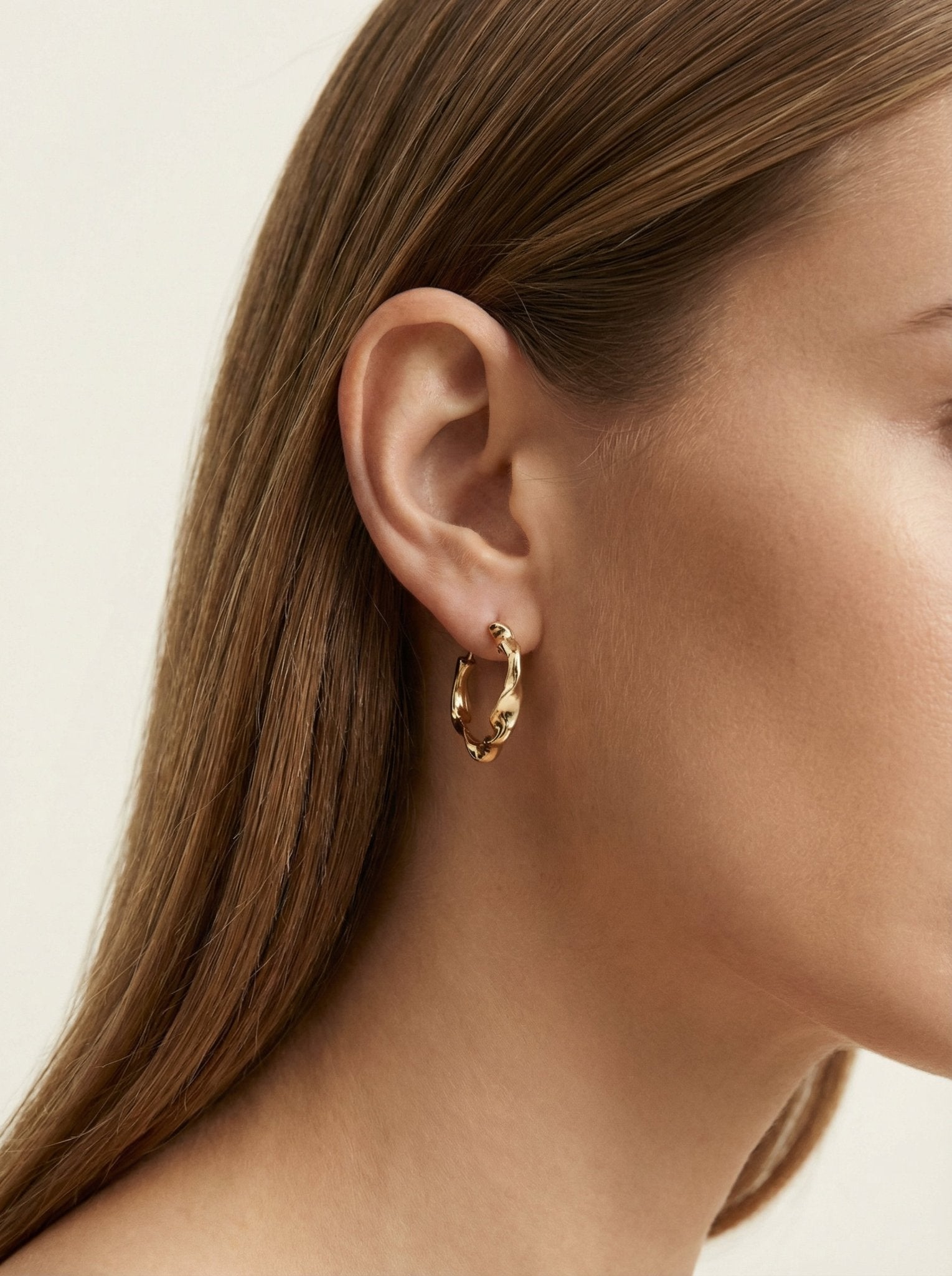 Gold twisted hoop earrings essence. Best minimalist jewelry made in Brooklyn New York by llayers.