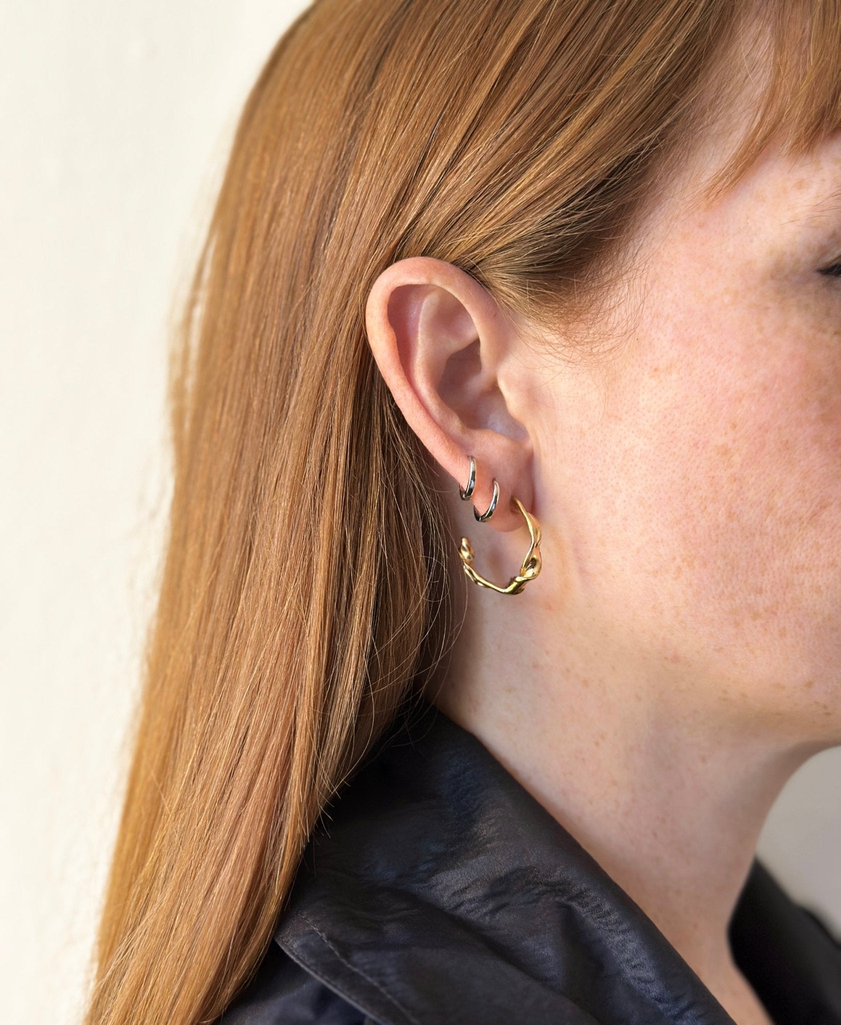 Minimalist Gold twisted hoop earrings essence. Best minimalist jewelry made in Brooklyn New York by llayers.