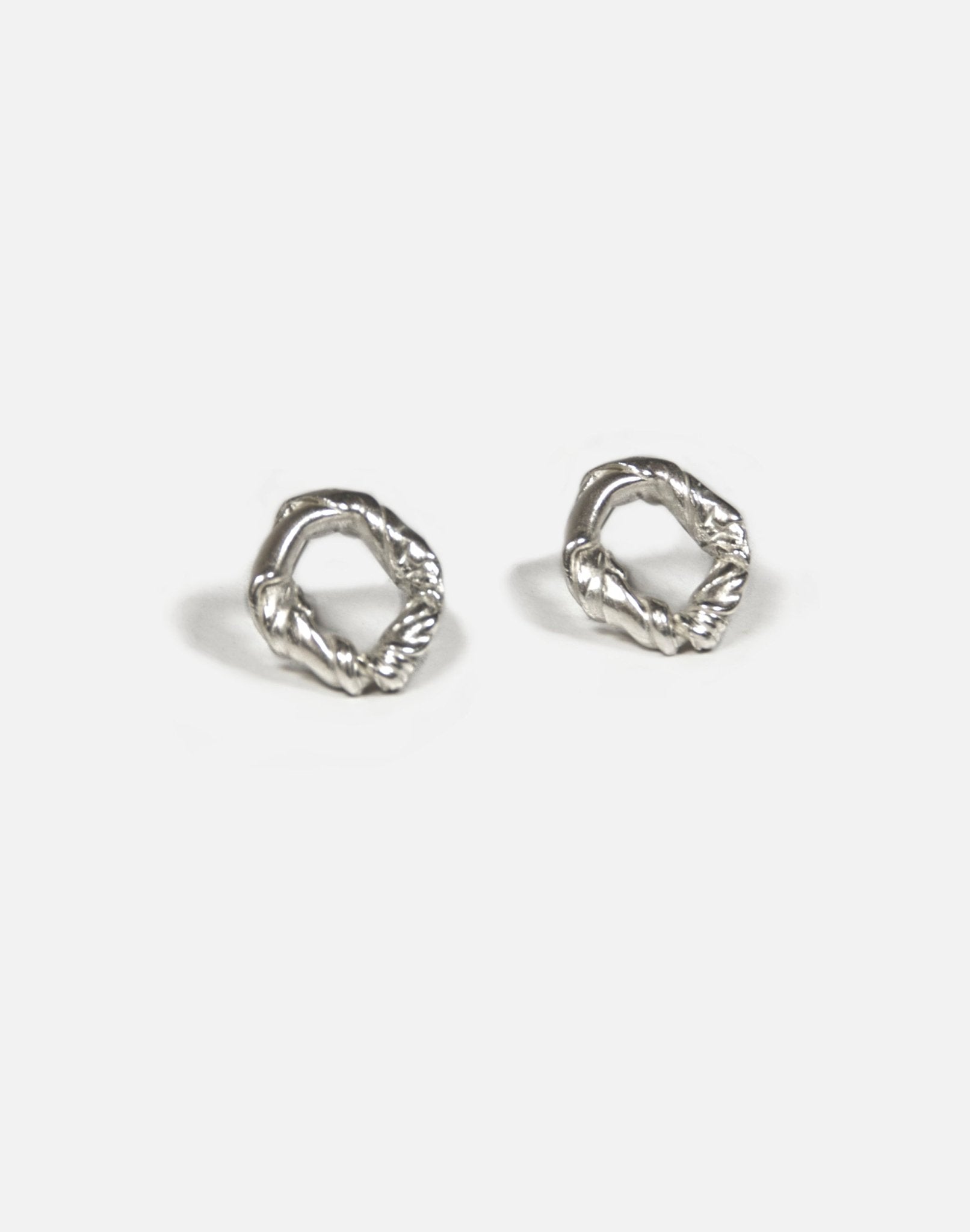 Minimalist Sterling silver twisted earrings. Jewelry made in Brooklyn New York by designer llayers.