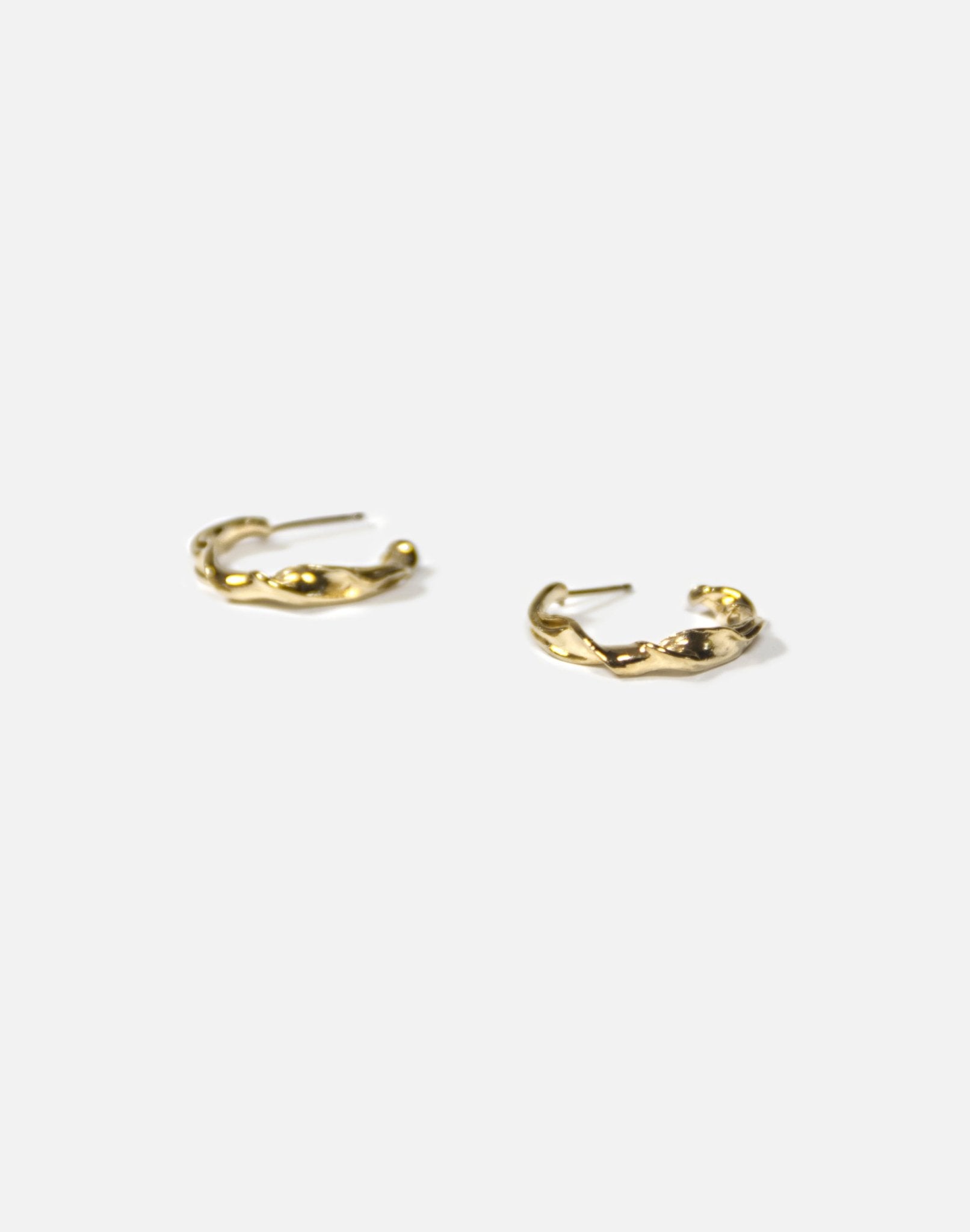 Modern Gold twisted hoop earrings essence. Minimalist jewelry made in Brooklyn New York by llayers.
