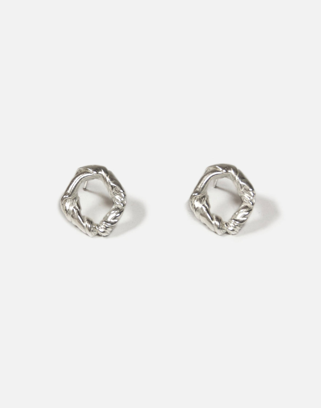 Modern Sterling silver twisted stud earrings. Jewelry made in Brooklyn New York by designer llayers.
