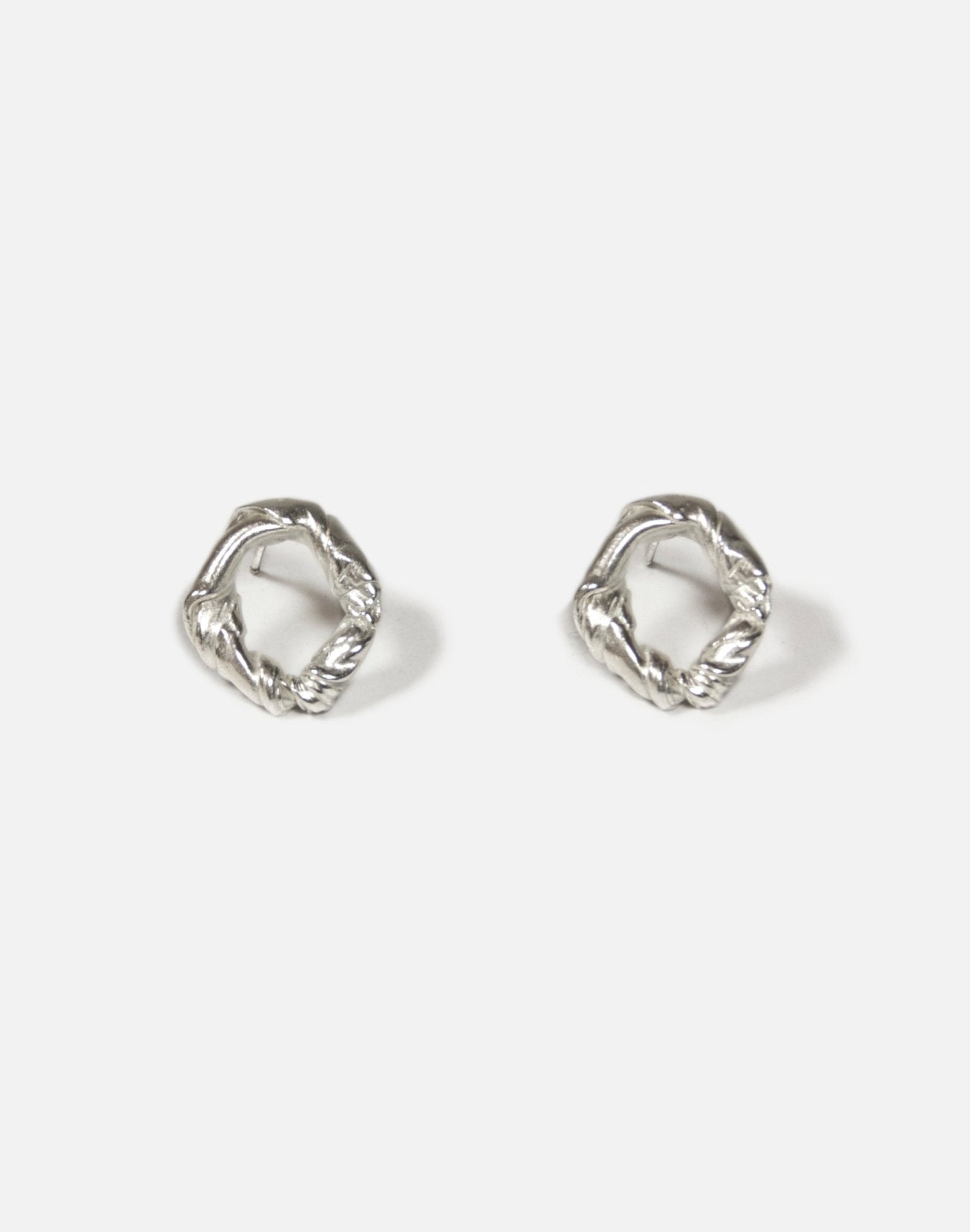Modern Sterling silver twisted stud earrings. Jewelry made in Brooklyn New York by designer llayers.