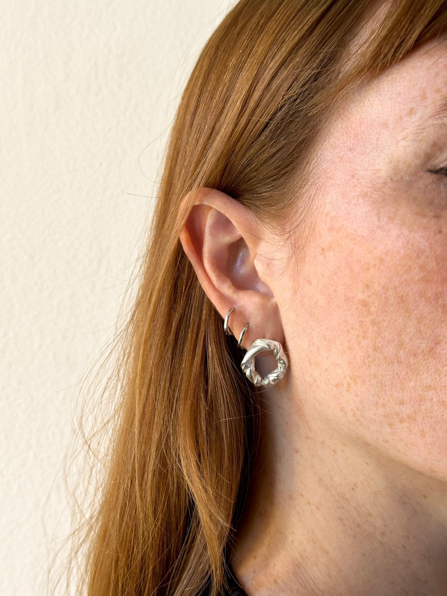 Modern women Sterling silver twisted stud earrings. Jewelry made in Brooklyn New York by designer llayers.