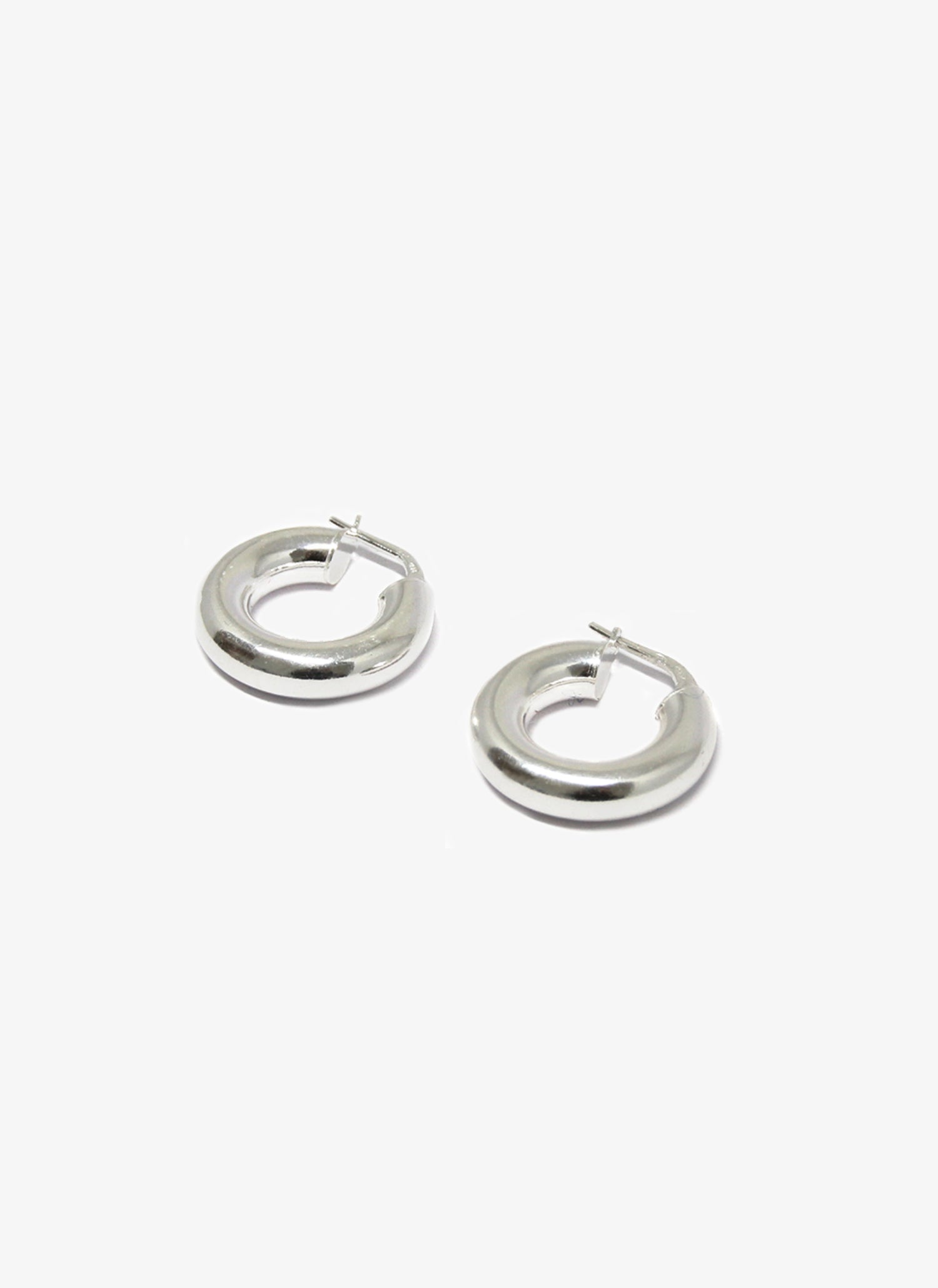 thick silver hoop earrings minimal designer jewelry in brookyn new york hoop 004