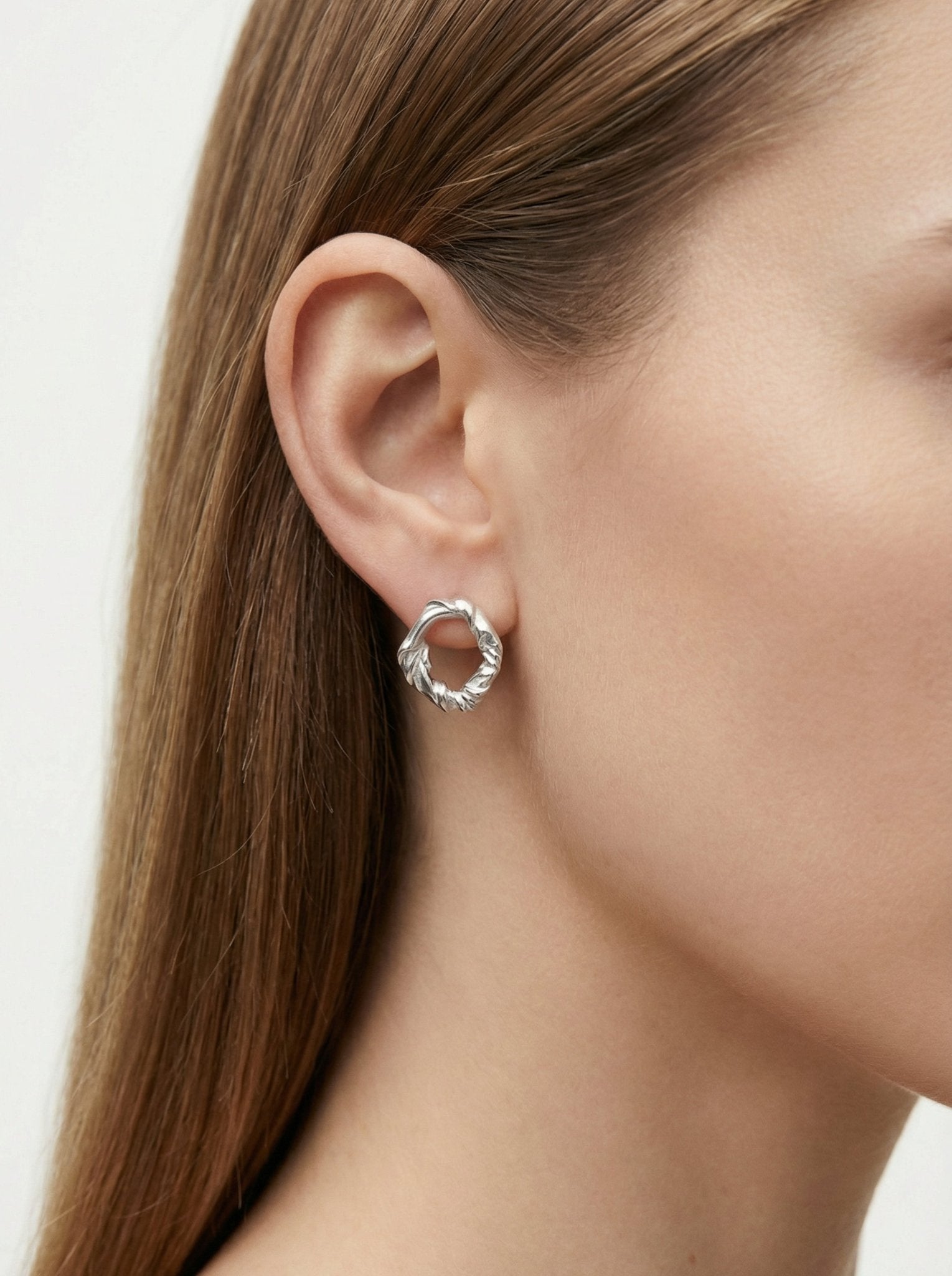 Sterling silver minimalist modern twisted earrings. Jewelry made in Brooklyn New York by designer llayers.