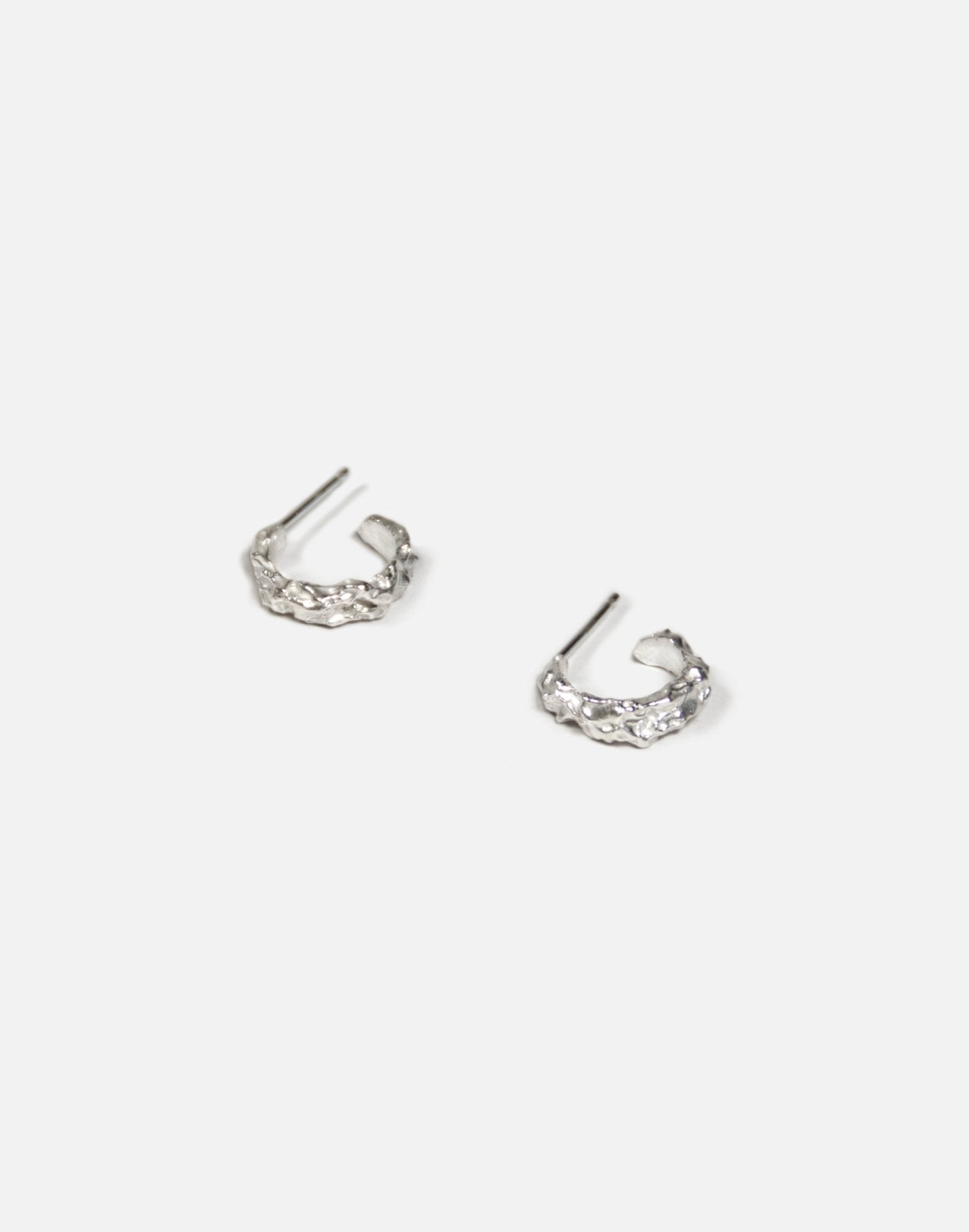 Sterling silver textured hoop earrings granite. Emerging designer. Minimalist jewelry made in Brooklyn New York by llayers.