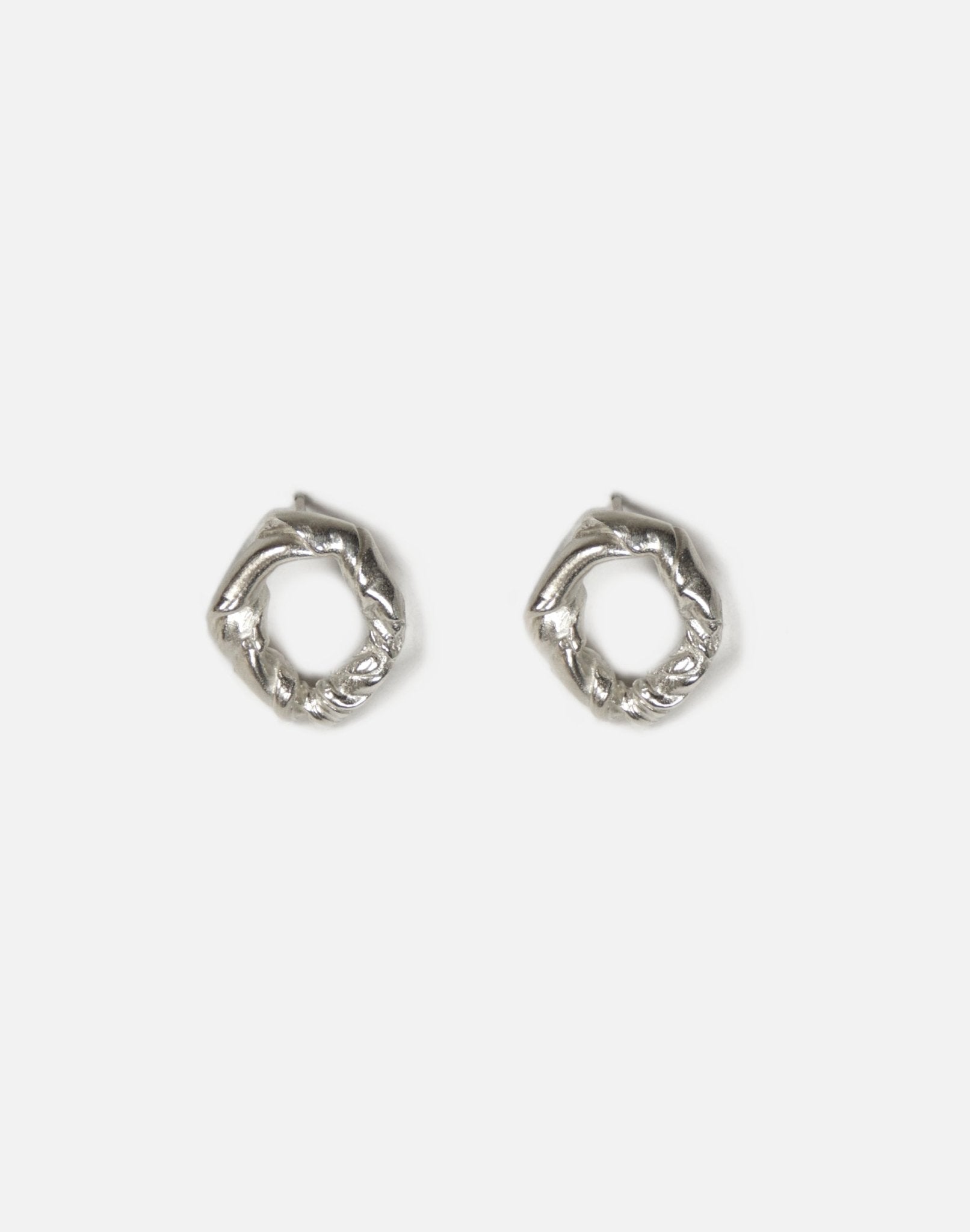 Sterling silver minimalist modern twisted earrings. Jewelry made in Brooklyn New York by designer llayers.