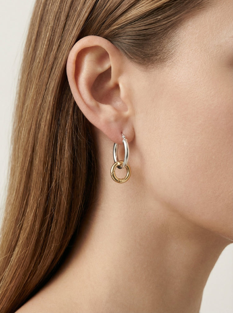 Two-shade gold and silver hoop earrings. Men's and women's minimalist jewelry brand in New York by llayers. Eternity