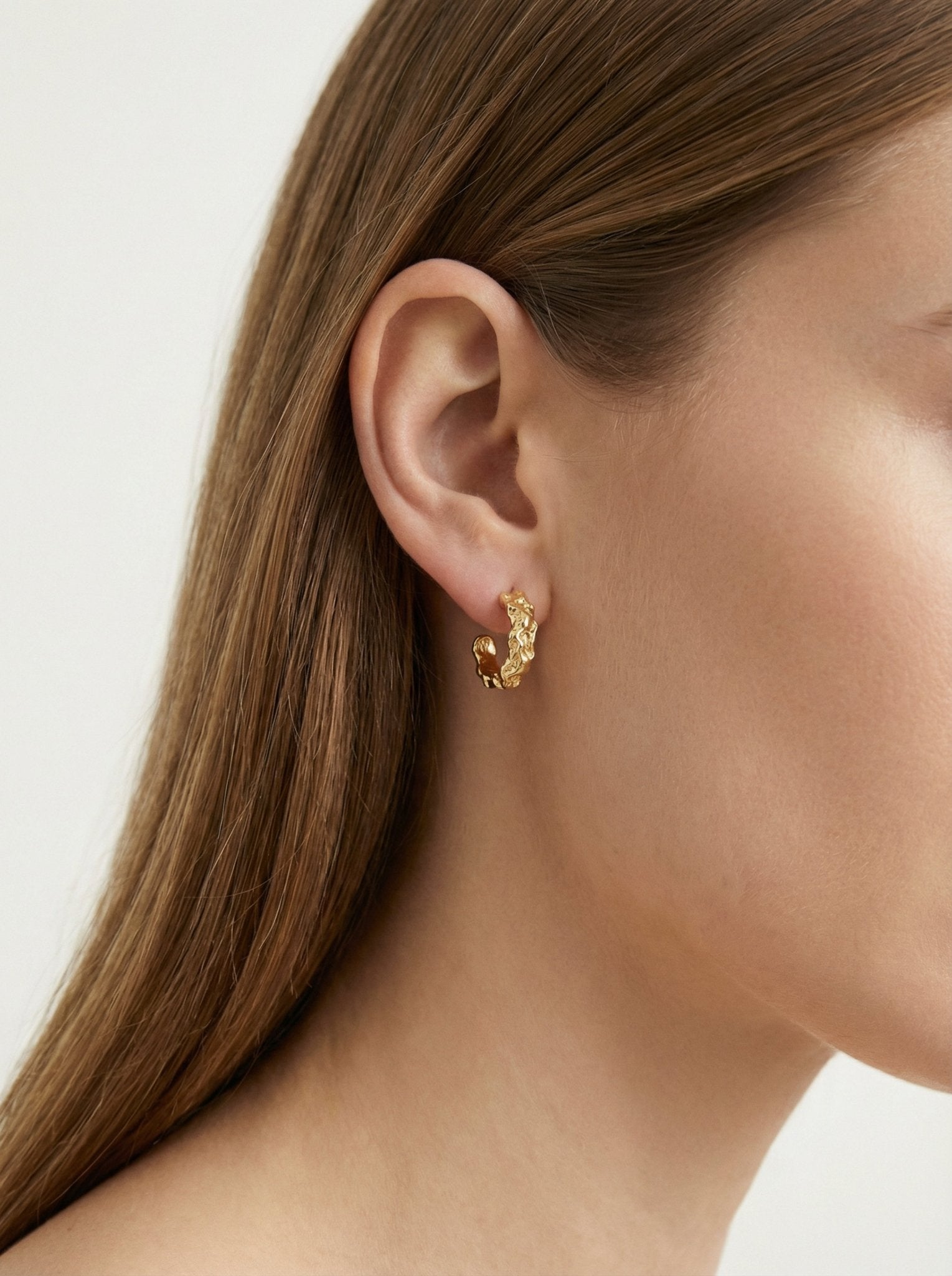 Gold textured hoop earrings granite. Emerging designer. Minimalist jewelry made in Brooklyn New York by llayers.