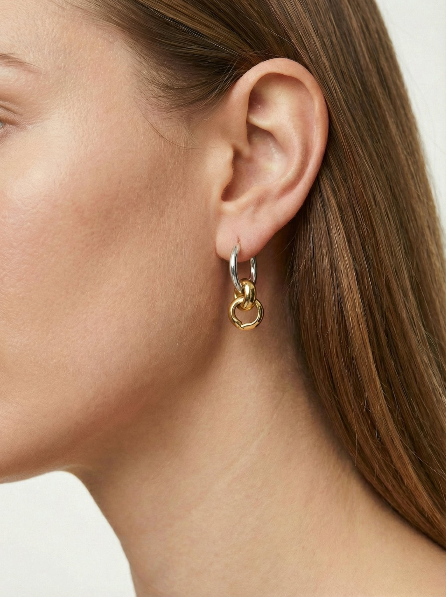 Silver and gold hoop earrings infinity minimal jewelry. Minimal jewelry made in New York by llayers.