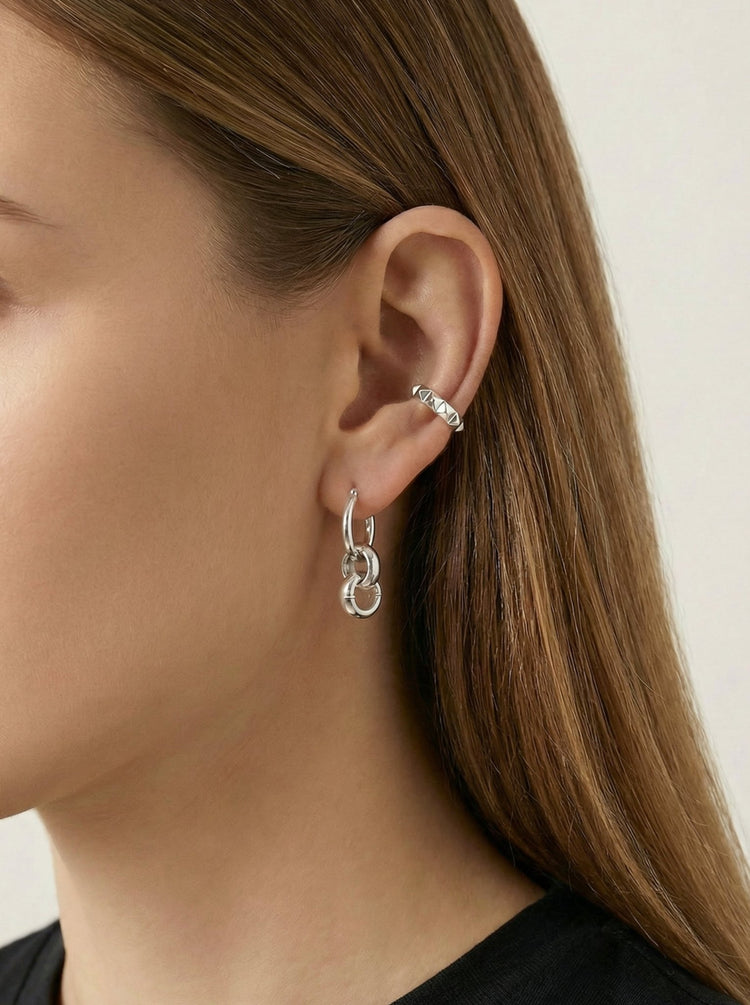 Silver hoops earrings in New York. Infinity minimal jewelry. Handcrafted in New York by llayers.