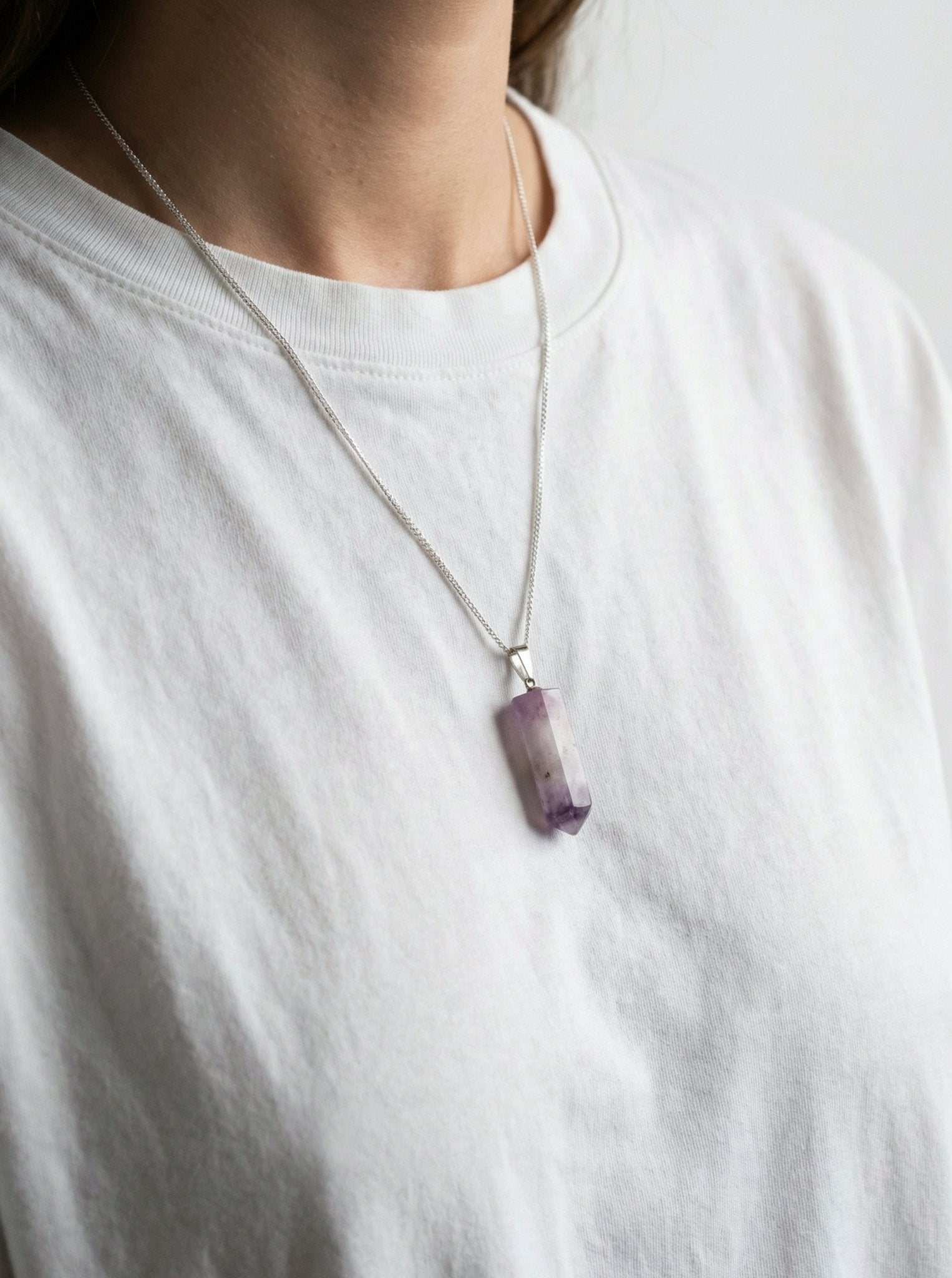 Amethyst point stone on silver chain pendant necklace. Charms and healing crystal stones jewelry made in New York by llayers.