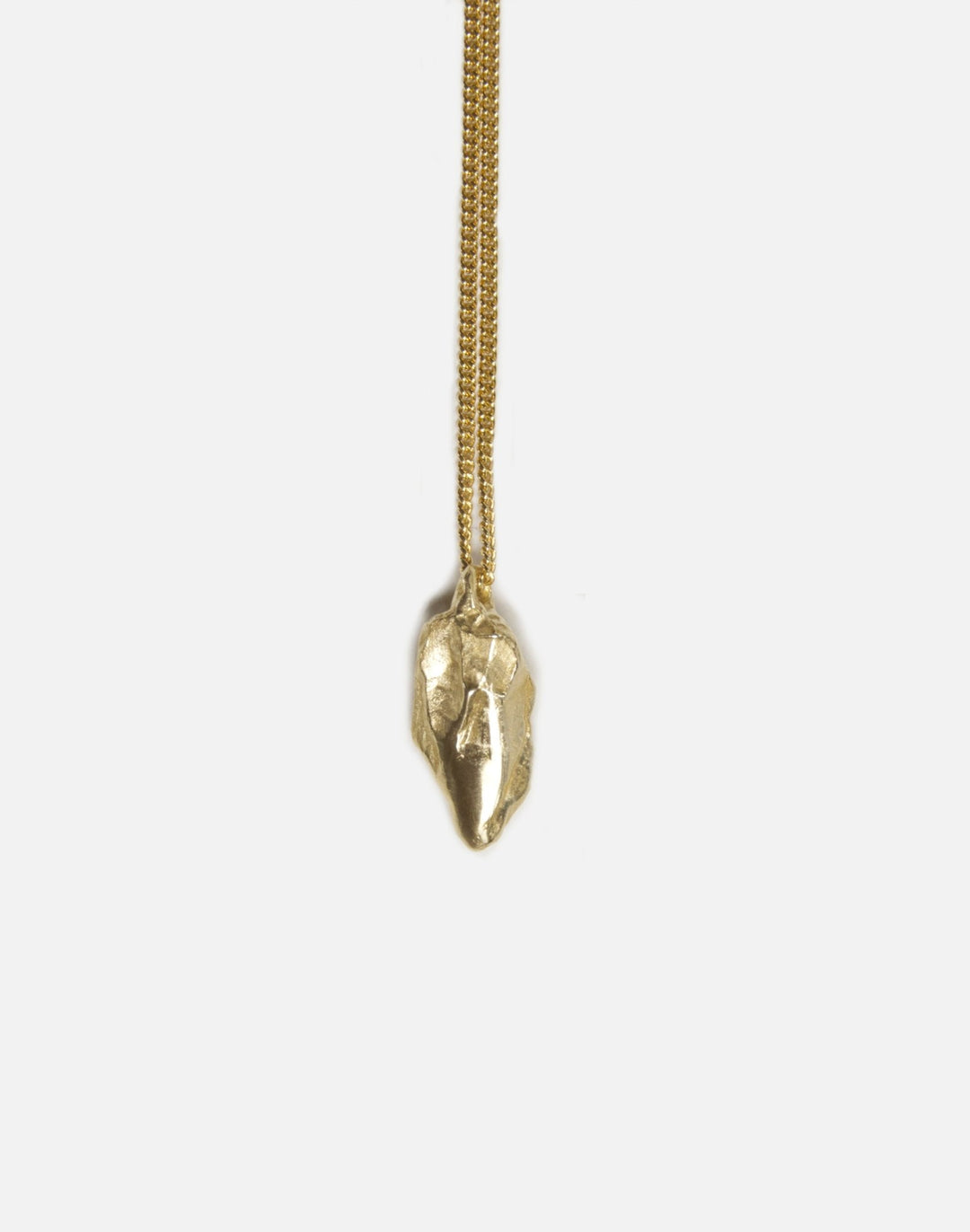 brass sculptural rock pendant necklace in brooklyn new york by llayers 