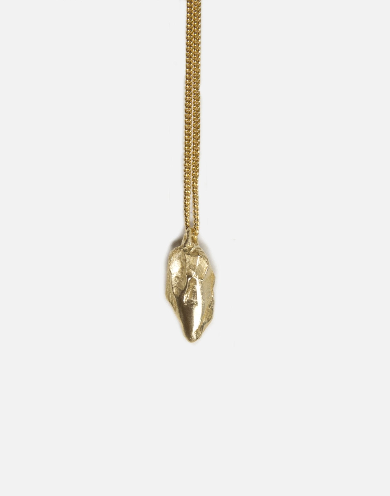 brass sculptural rock pendant necklace in brooklyn new york by llayers 