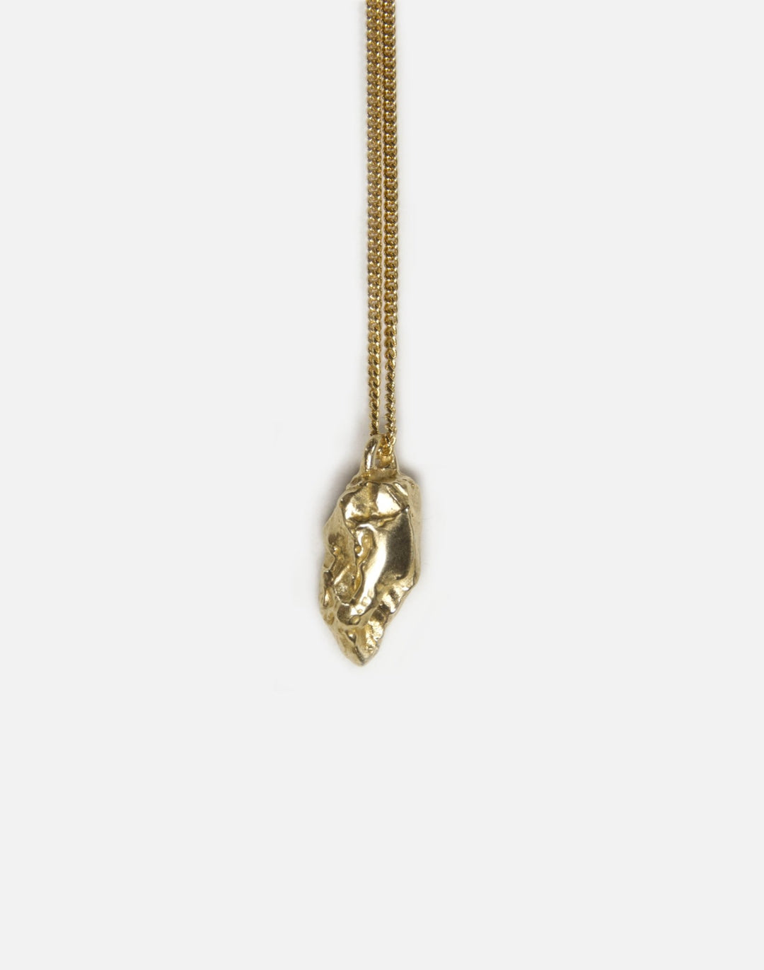brass sculptural rock pendant necklace in brooklyn new york by llayers 