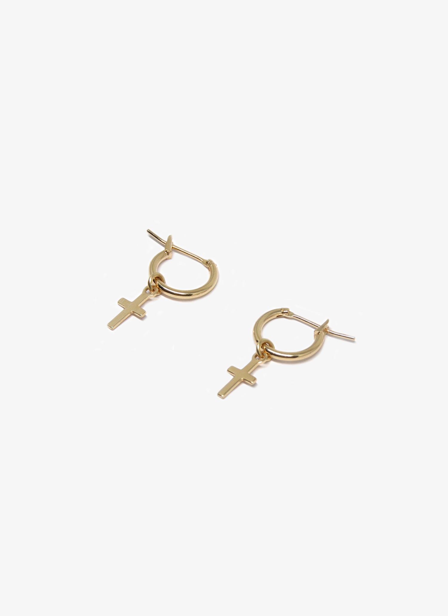 Gold hoop earrings with cross designs on a white background