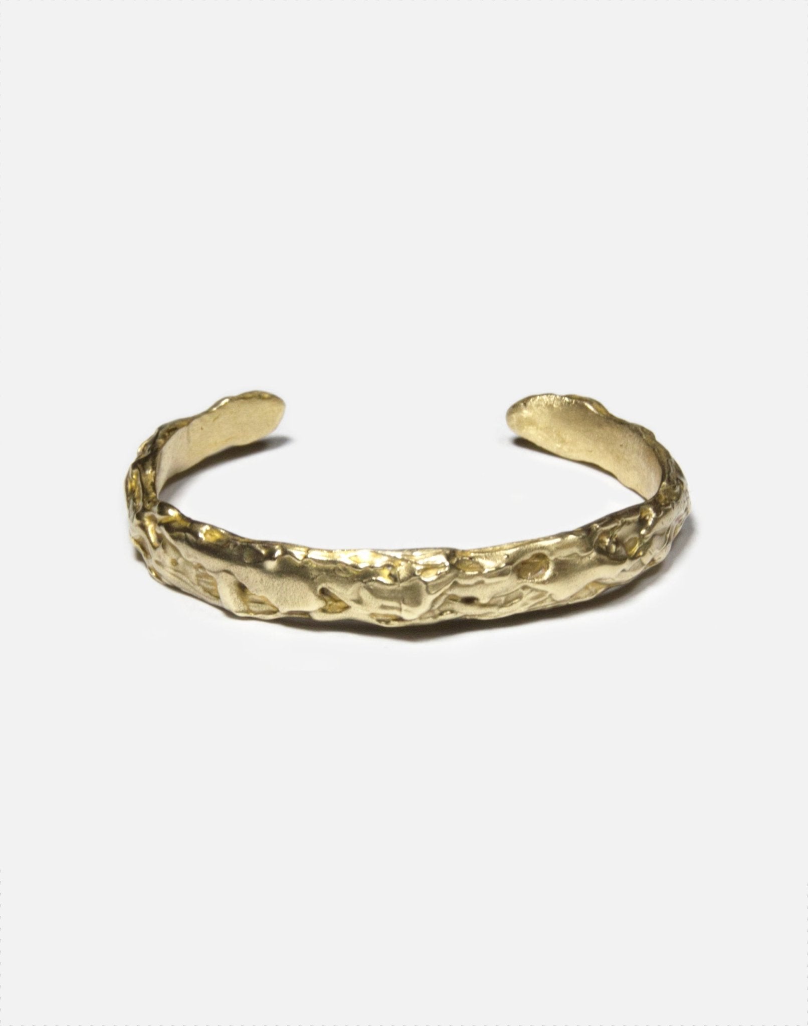 minimal gold brass sculptural molten cuff bracelet in New York
