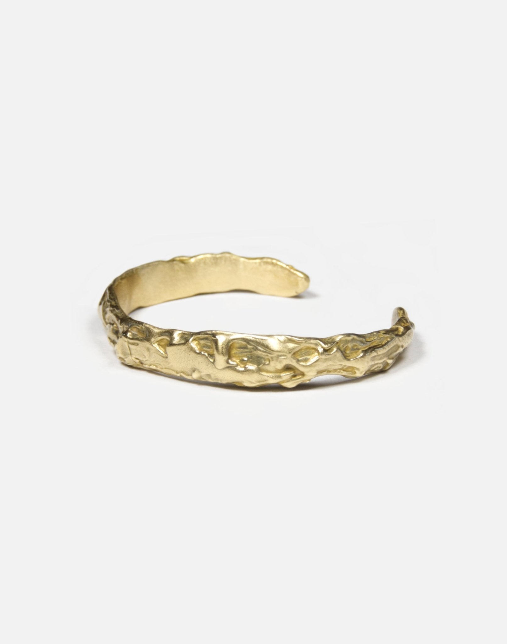 women's minimal gold brass sculptural molten cuff bracelet in New York
