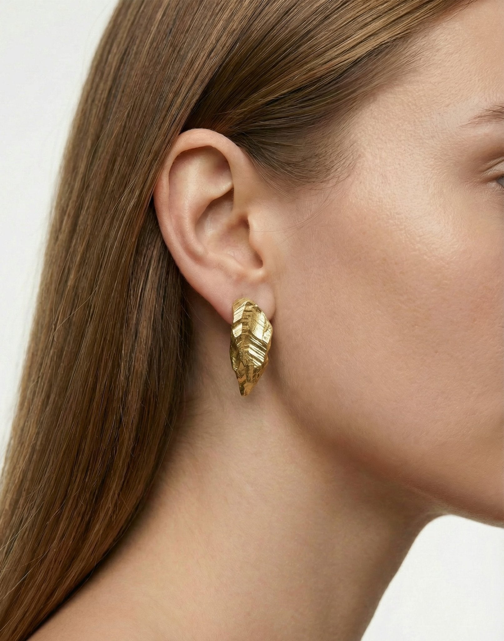 Gold plated sculptural stud earrings. Layers rock formations.Made in new york by llayers.
