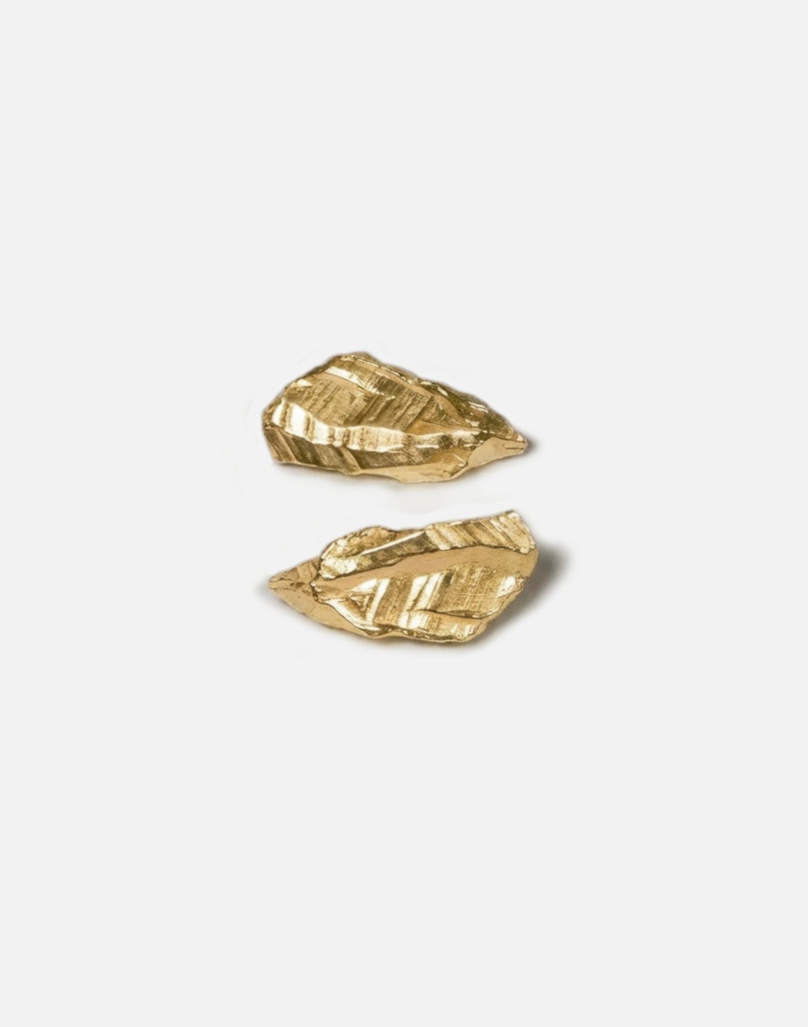 Gold plated sculptural stud earrings. Layered rock formations.Made in new york by llayers.