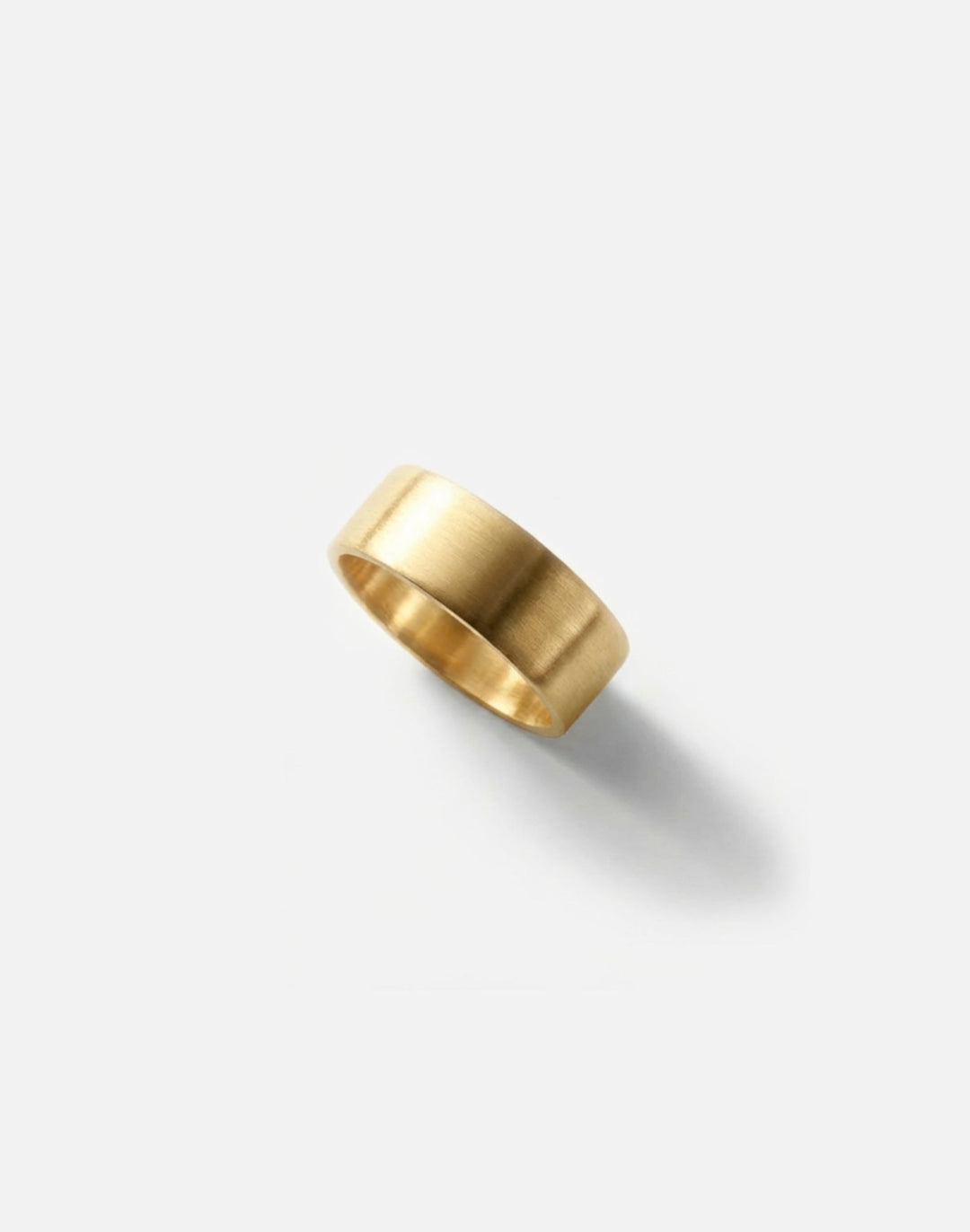 Men's gold round ring band. Modern minimalist jewelry men's and wome'ns made in Brooklyn New York by llayers.