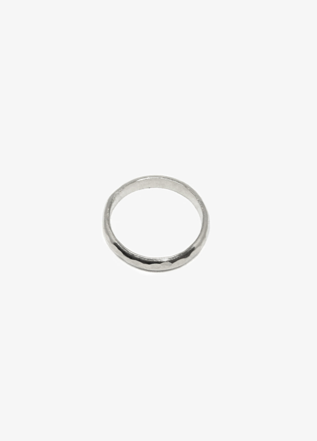 Men's modern silver hammered round ring. Minimalist engagement rings in Brooklyn New York by designer llayers.