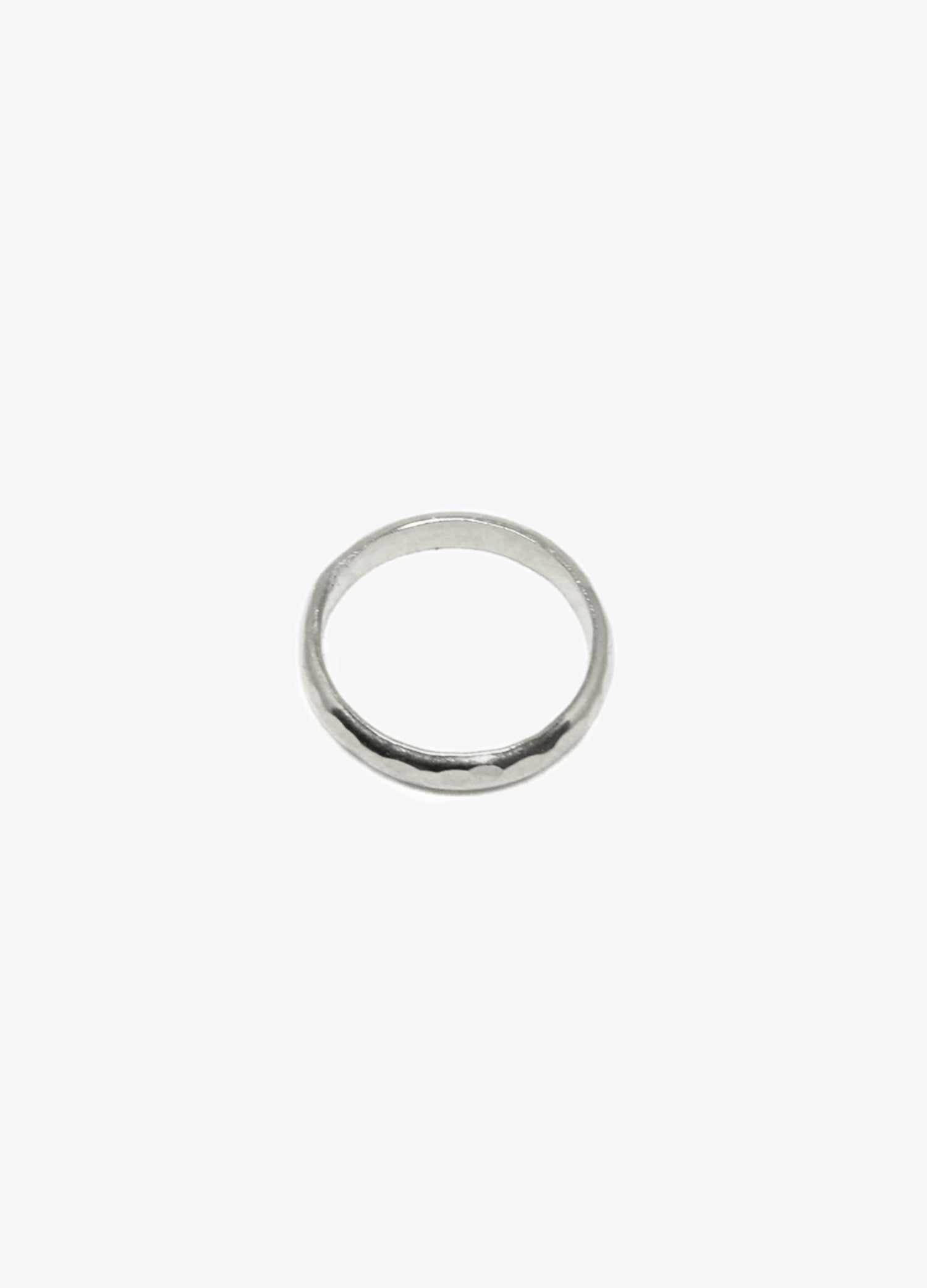 Men's modern silver hammered round ring. Minimalist engagement rings in Brooklyn New York by designer llayers.