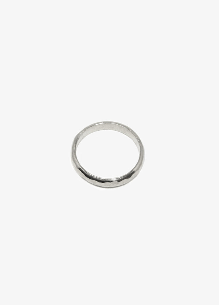 Men's modern silver hammered round ring. Minimalist engagement rings in Brooklyn New York by designer llayers.