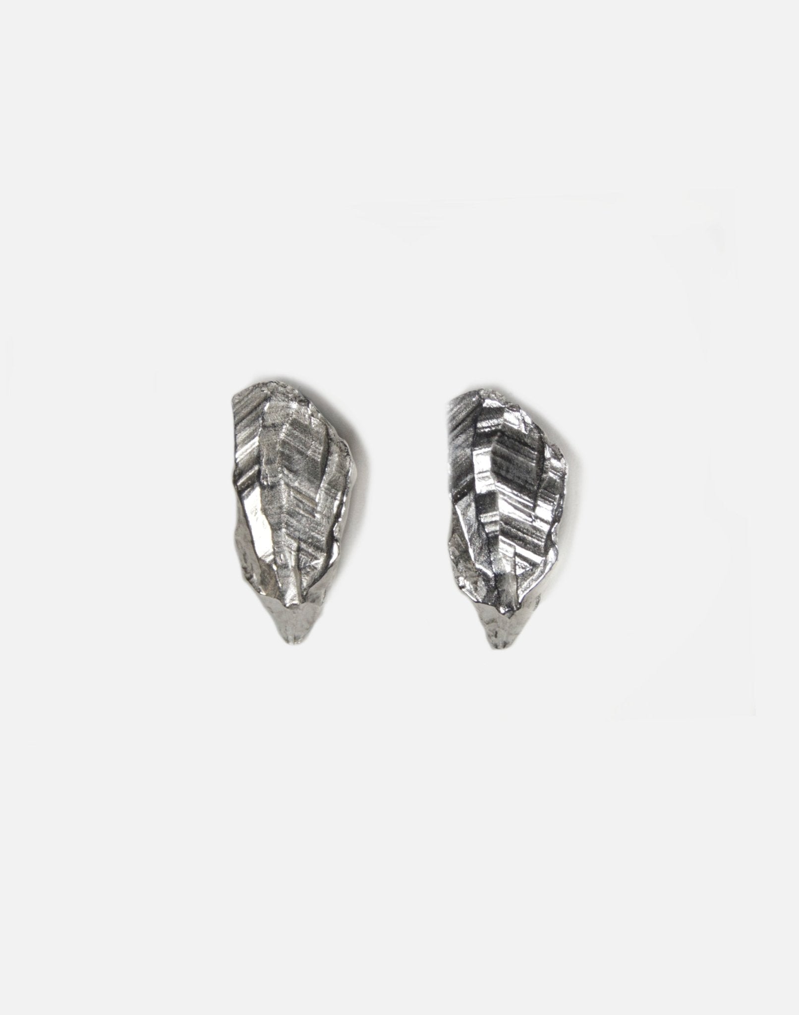 sterling silver sculptural stud earrings. Layered rock formations.Made in new york by llayers.