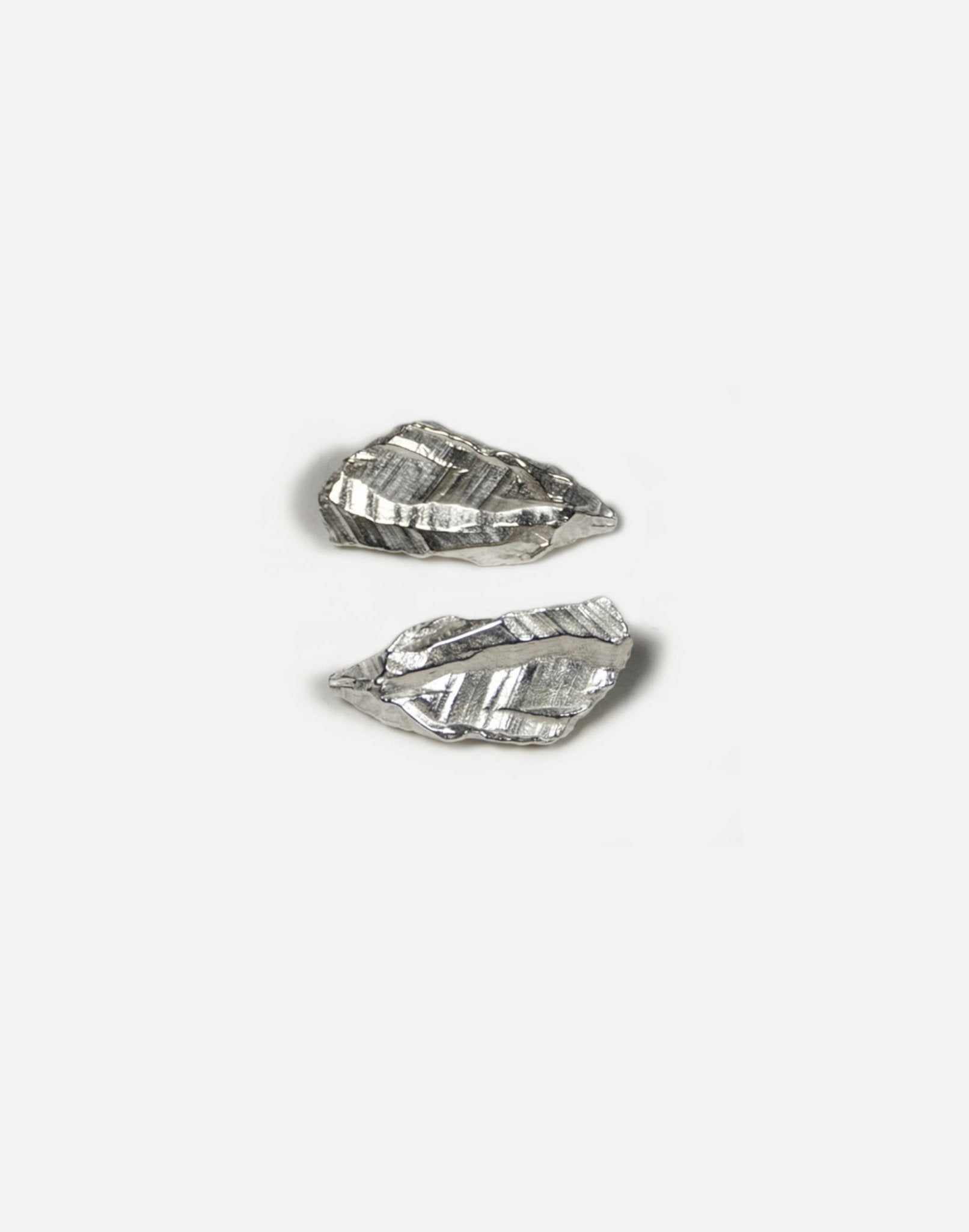 sterling silver sculptural stud earrings. Layered rock formations.Made in new york by llayers.