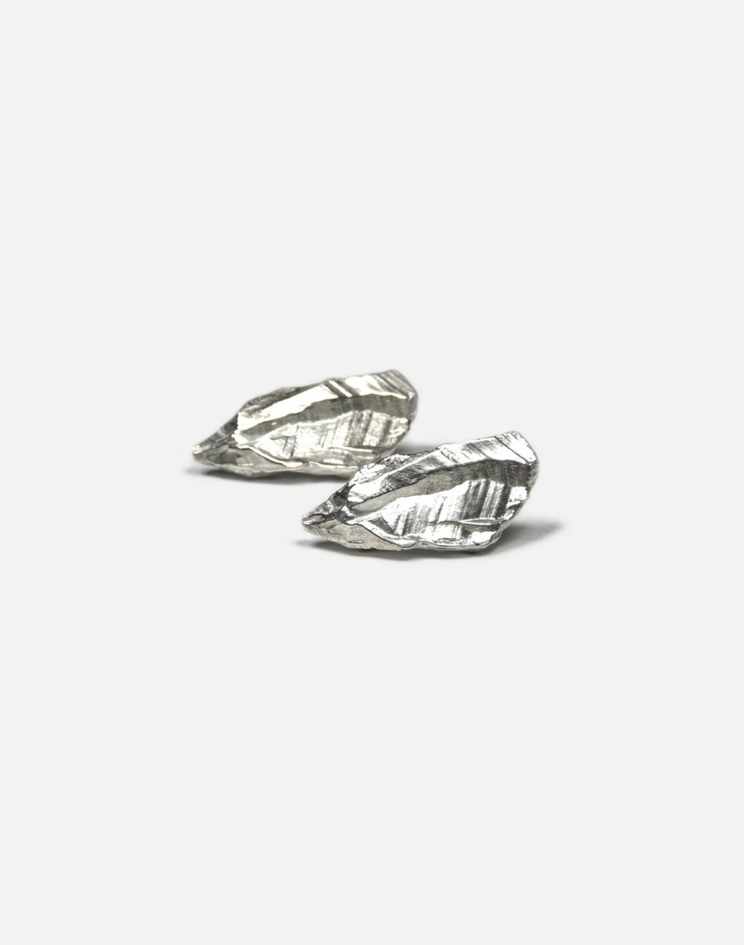 sterling silver sculptural stud earrings. Layered rock formations.Made in new york by llayers.