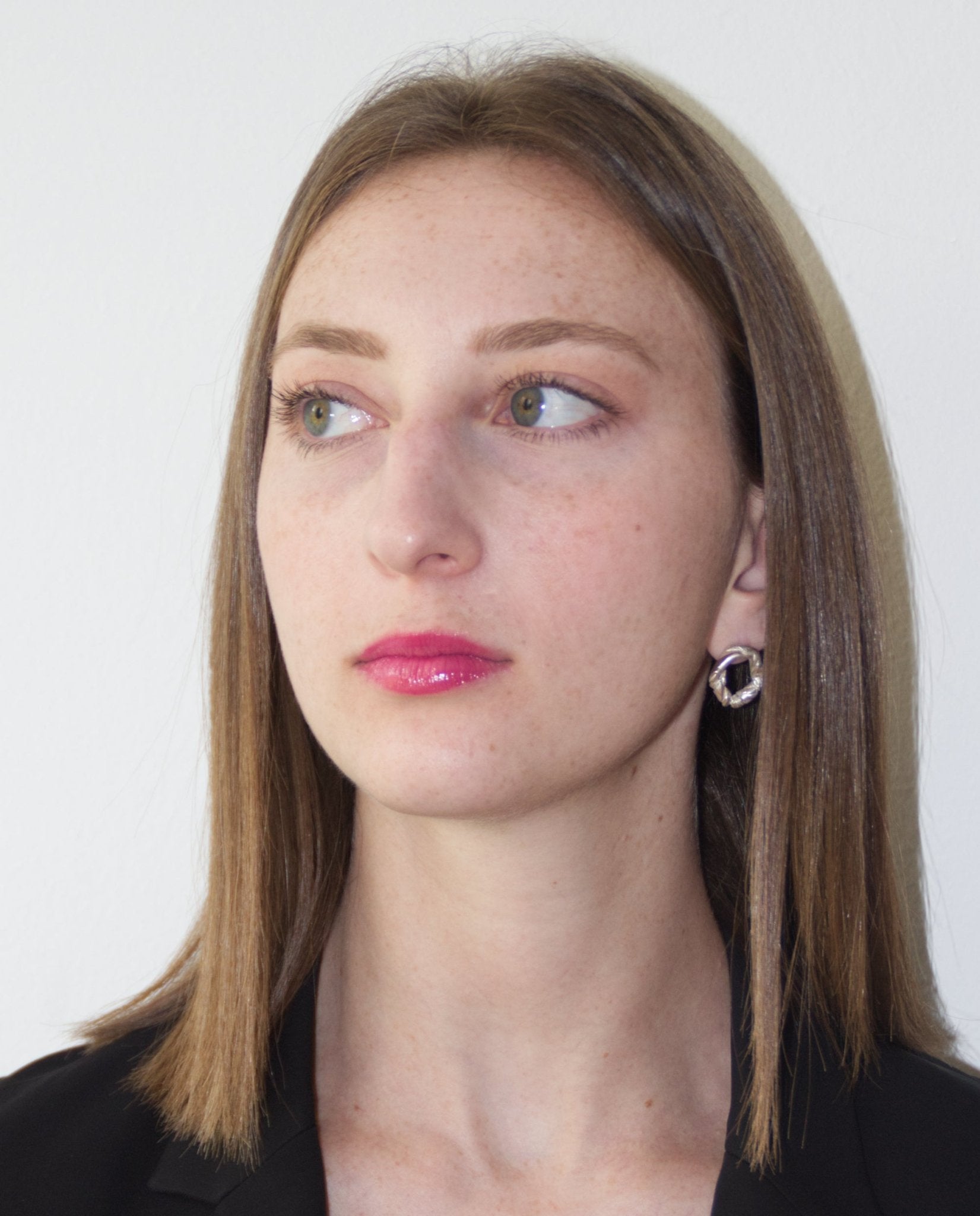 Sterling silver minimalist modern twisted earrings. Jewelry made in Brooklyn New York by designer llayers.