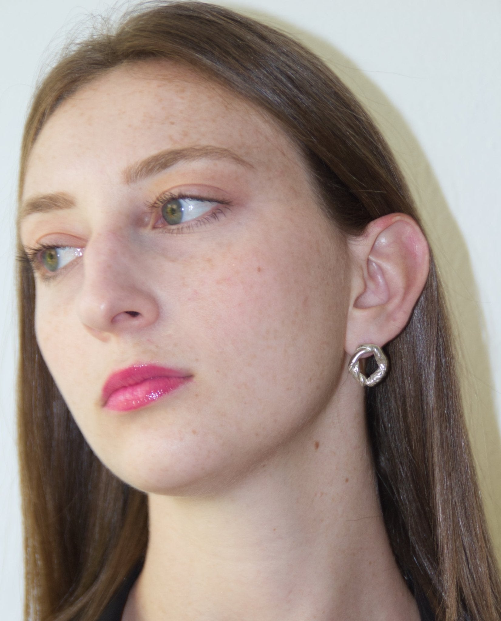 Sterling silver minimalist modern twisted earrings. Jewelry made in Brooklyn New York by designer llayers.