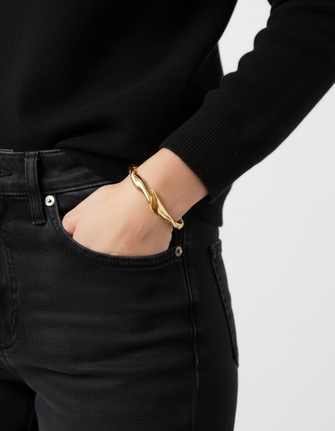 Gold twisted cuff bracelet. Minimalist and modern jewelry made in Brooklyn New York by llayers.